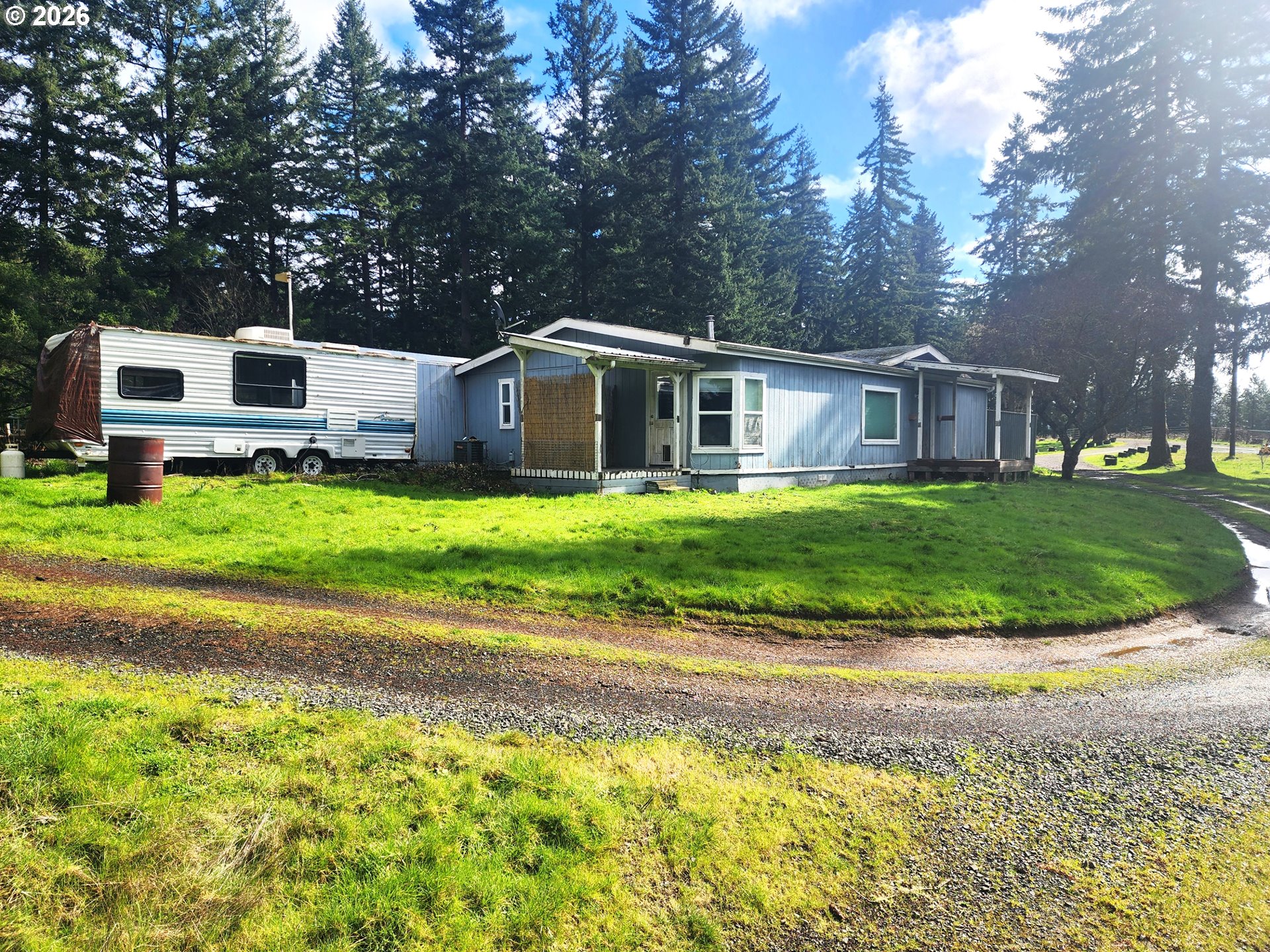 85106 Territorial Highway Eugene, OR 97402 - Photo 3 of 48 a front view of a house with a garden and trees