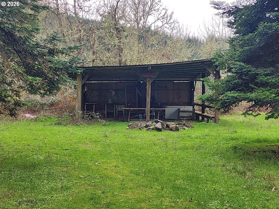85106 Territorial Highway Eugene, OR 97402 - Photo 47 of 48 a view of backyard with a barn and large trees