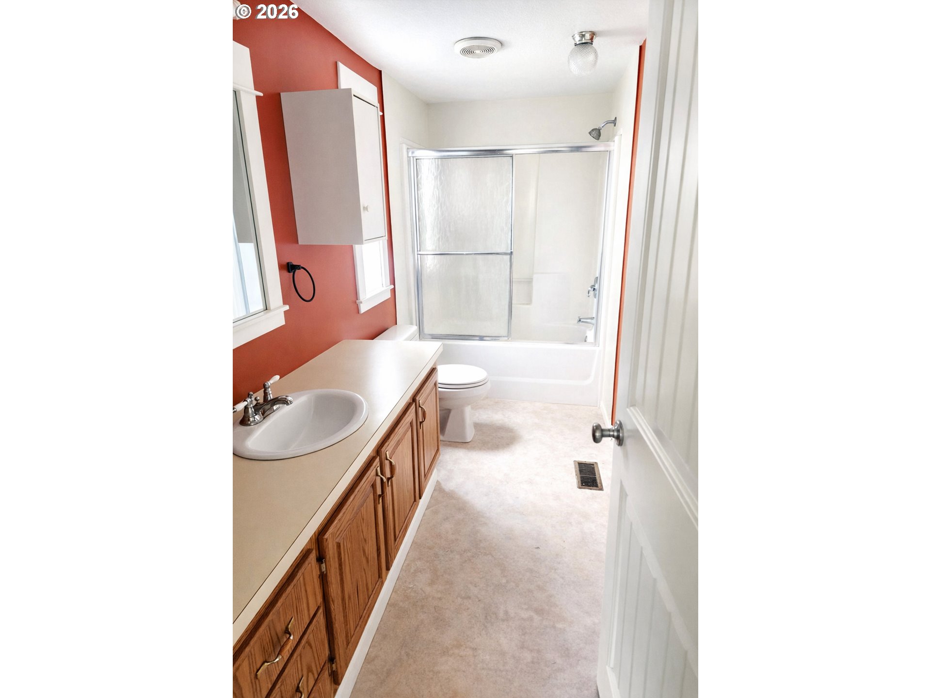 85106 Territorial Highway Eugene, OR 97402 - Photo 9 of 48 a bathroom with a sink a mirror and a bathtub