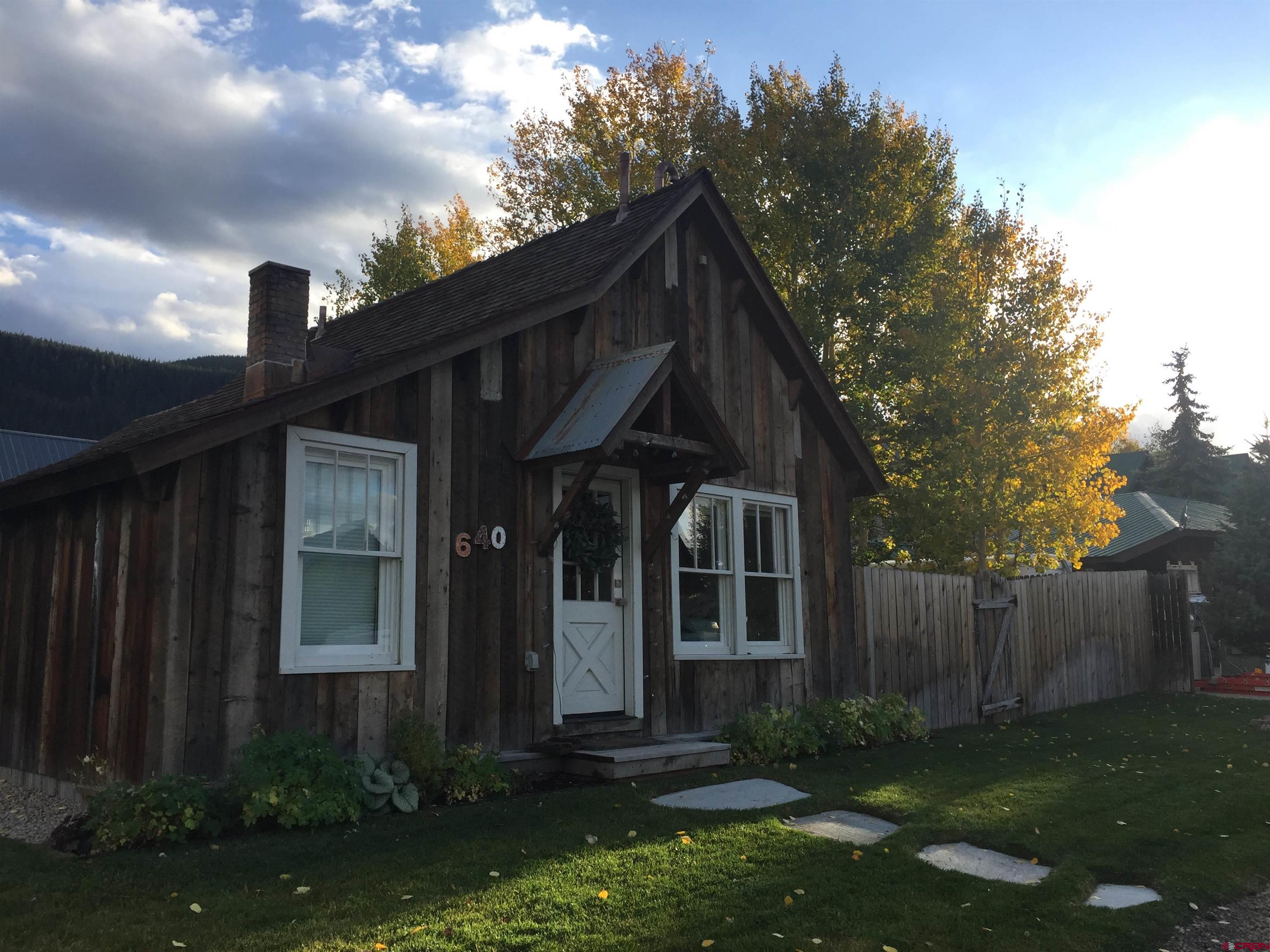 640 Elk Avenue Crested Butte, CO 81224 - Photo 14 of 45 a front view of a house with garden