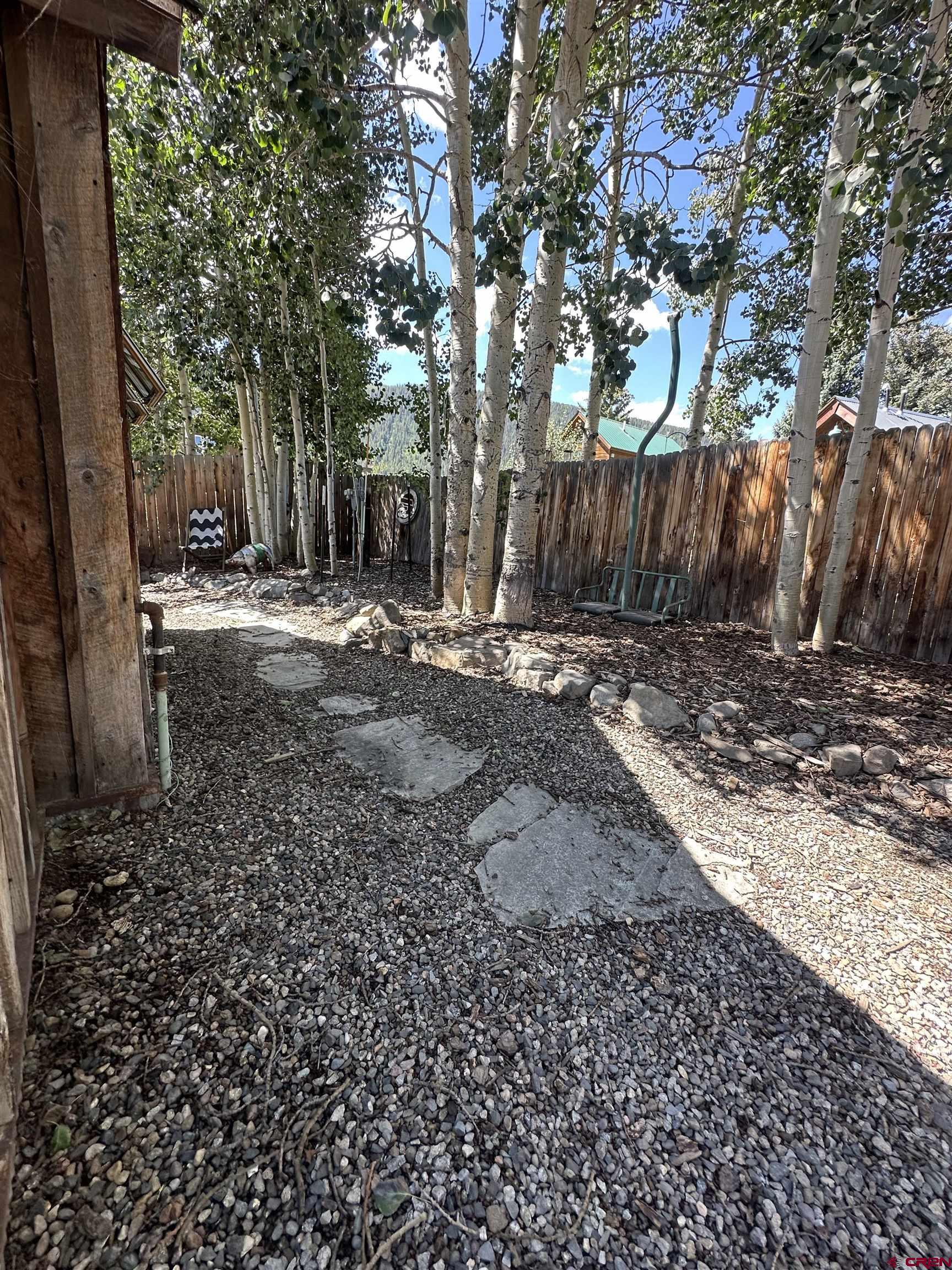 640 Elk Avenue Crested Butte, CO 81224 - Photo 21 of 45 a view of a yard with wooden fence