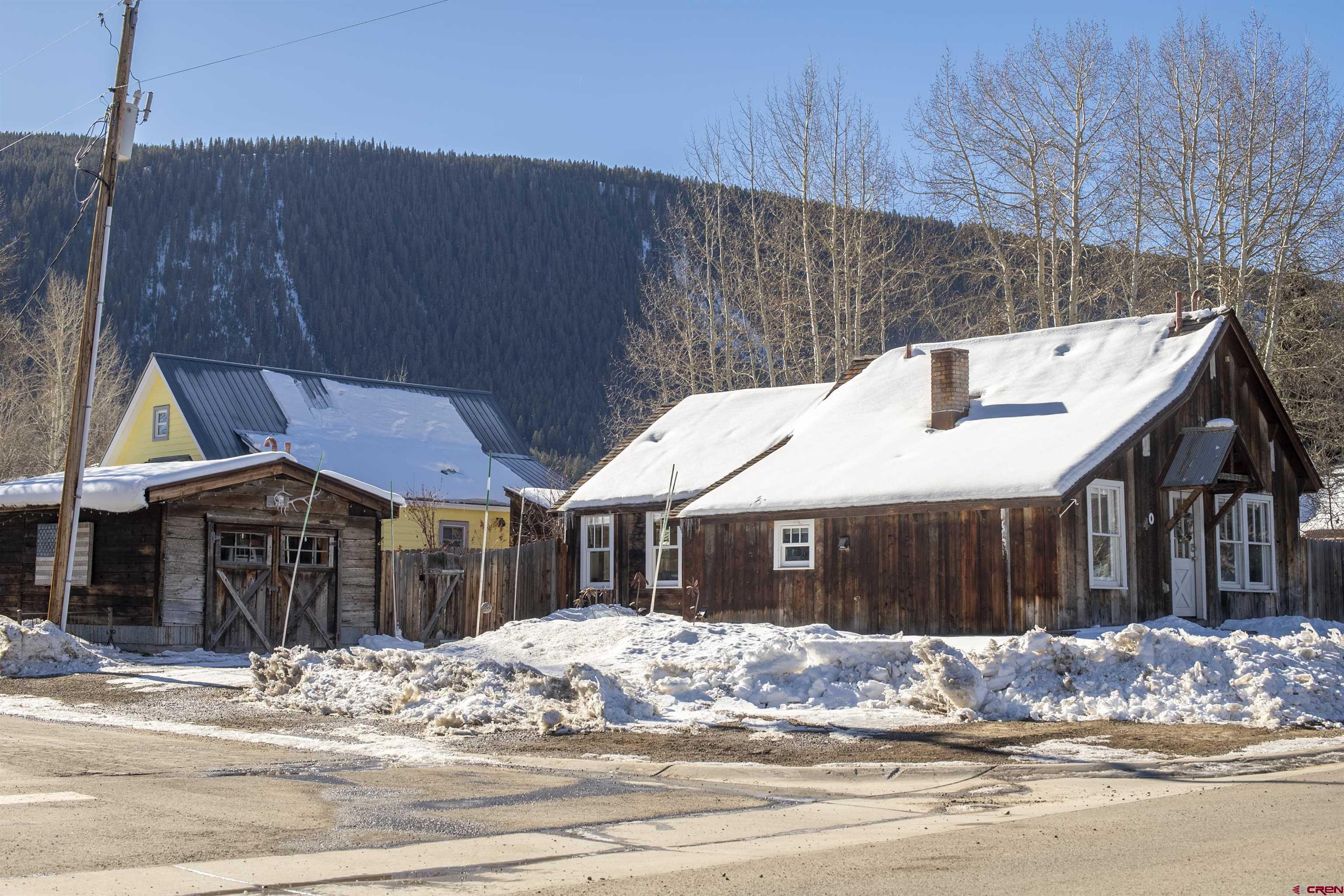 640 Elk Avenue Crested Butte, CO 81224 - Photo 22 of 45 a front view of a house with a yard