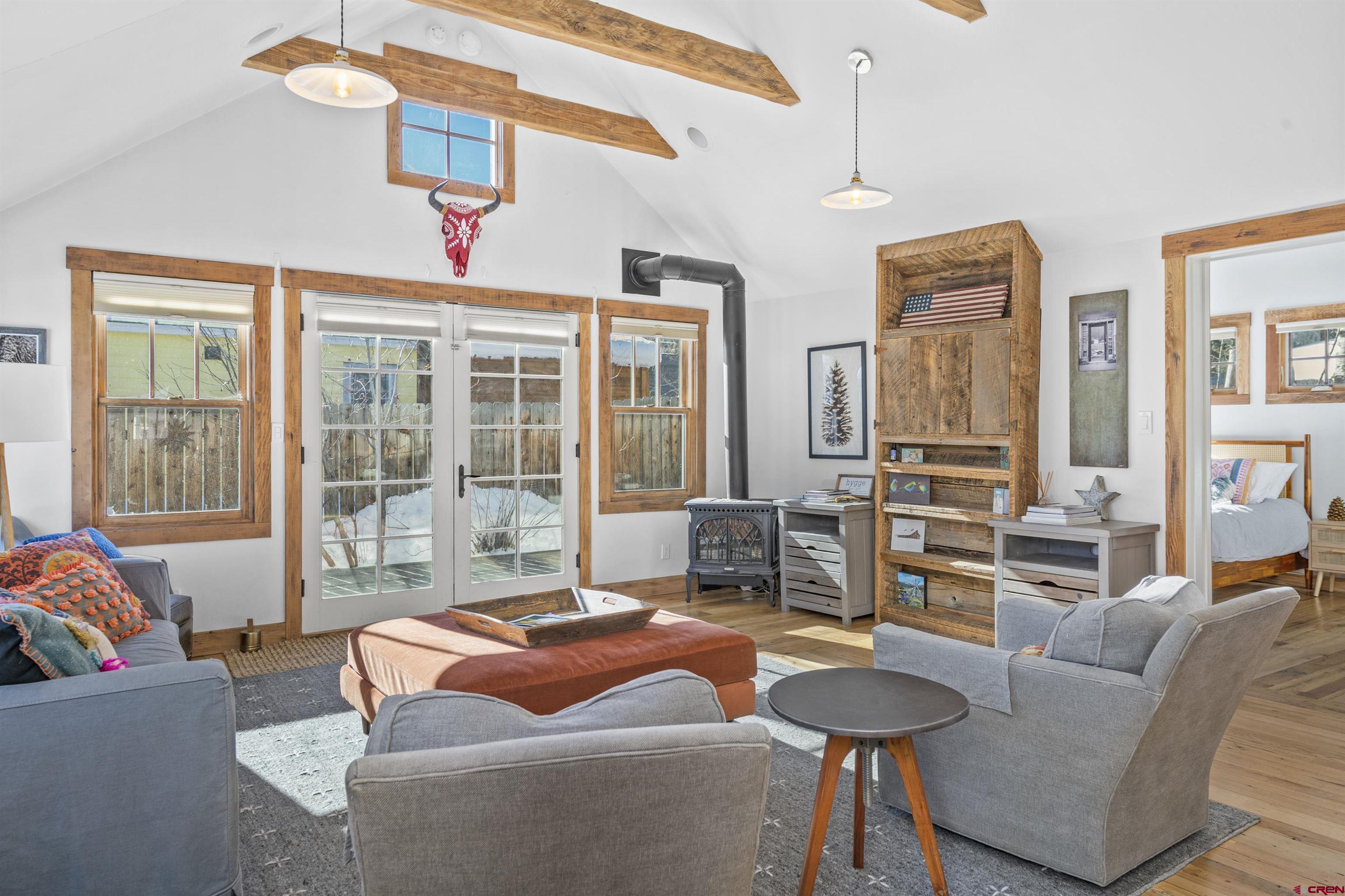 640 Elk Avenue Crested Butte, CO 81224 - Photo 33 of 45 a living room with furniture and a large window