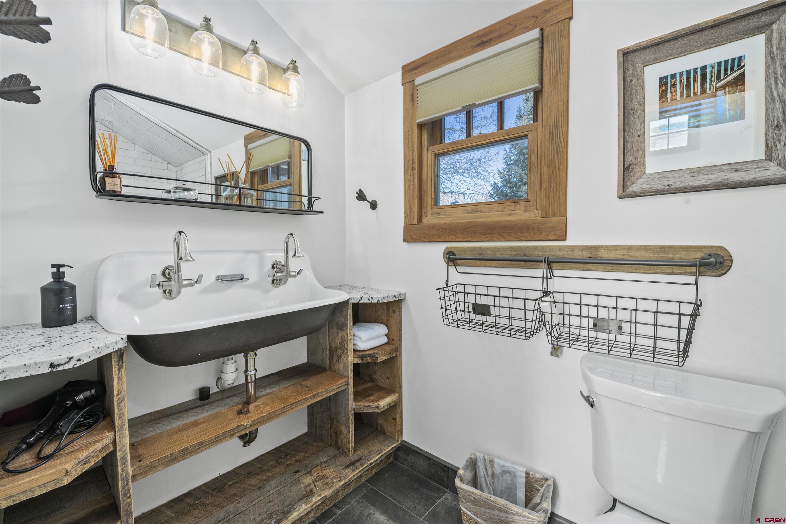 640 Elk Avenue Crested Butte, CO 81224 - Photo 34 of 45 a bathroom with a sink and a mirror