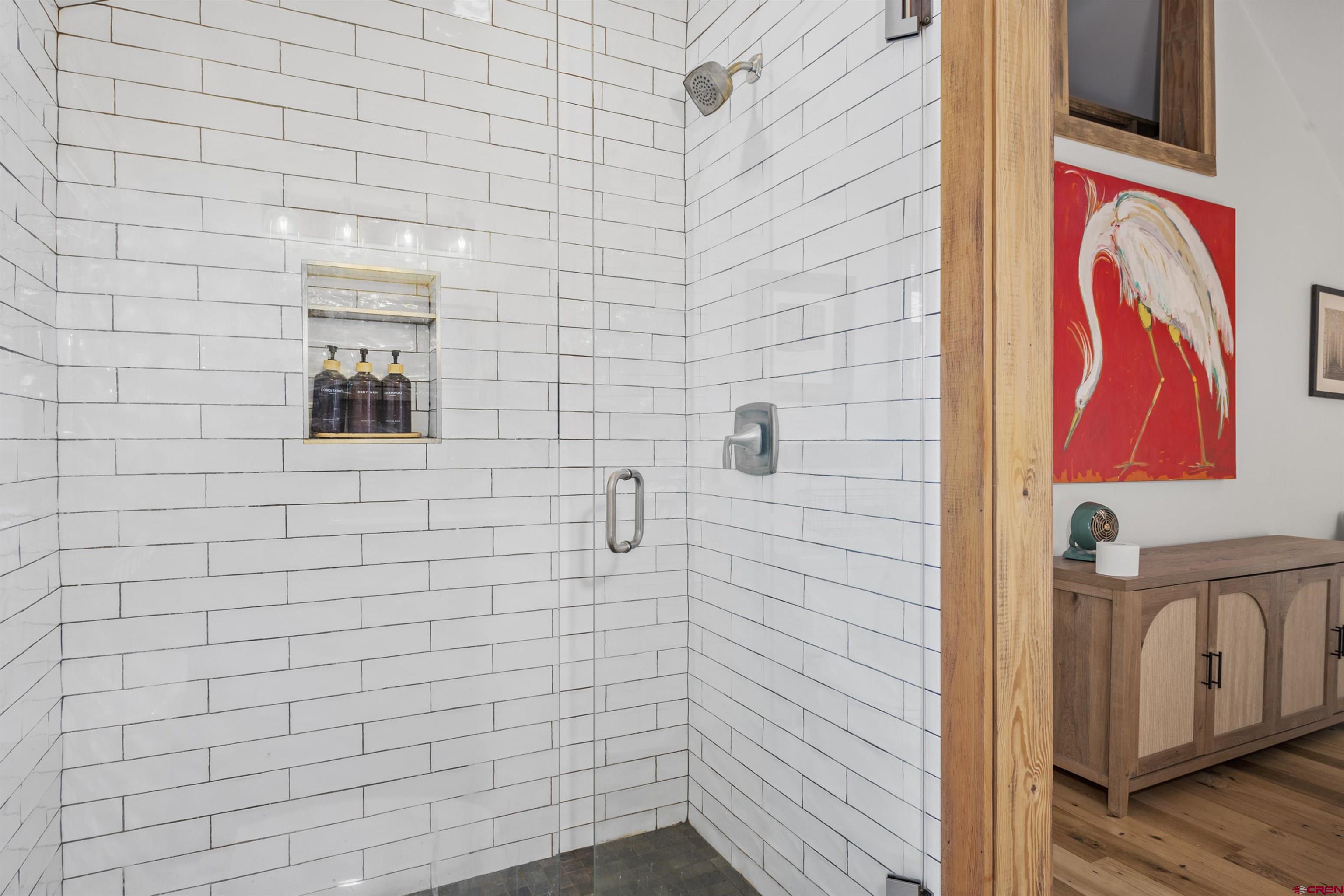 640 Elk Avenue Crested Butte, CO 81224 - Photo 35 of 45 a bathroom with a shower and a sink