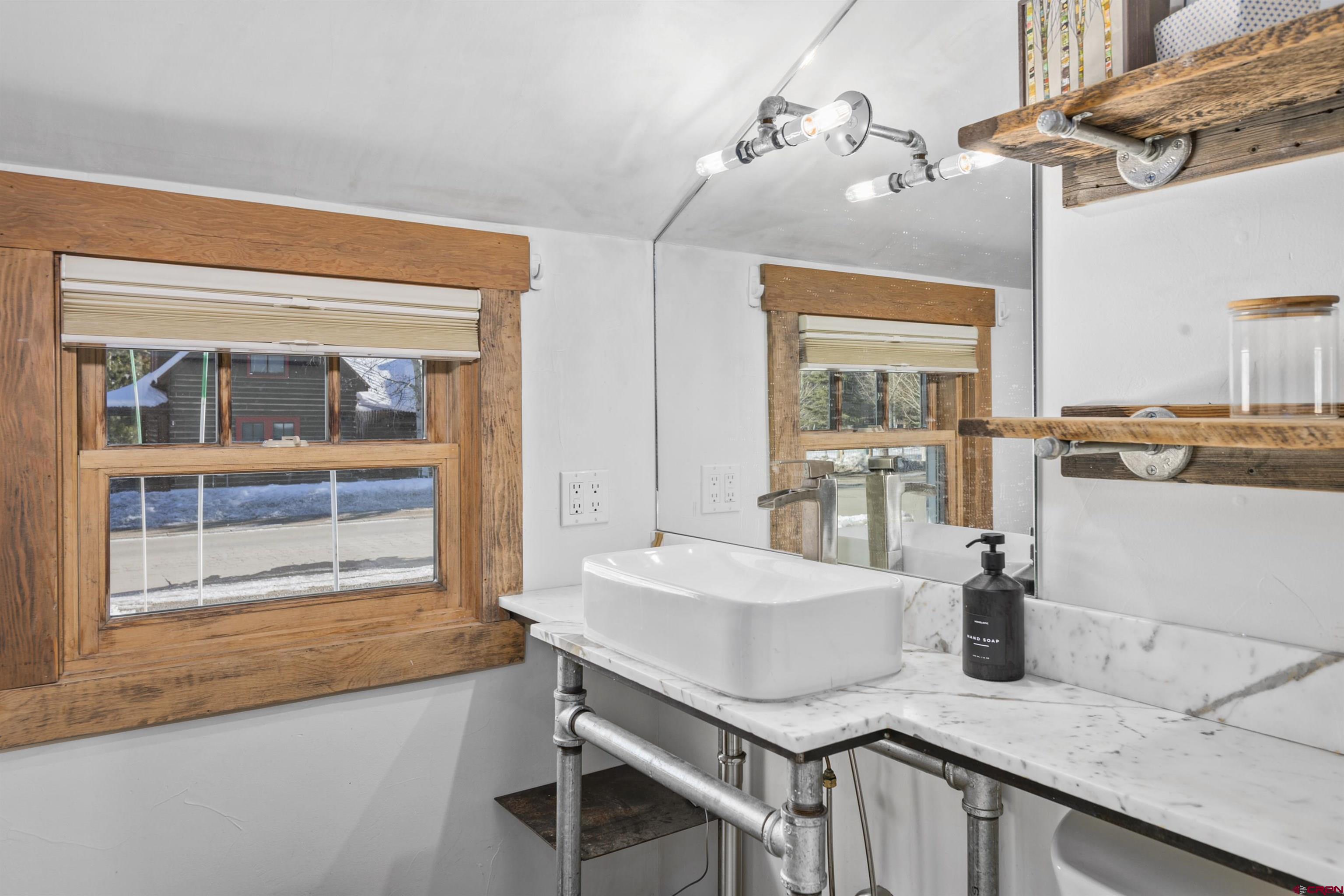 640 Elk Avenue Crested Butte, CO 81224 - Photo 39 of 45 a living room with furniture and a window