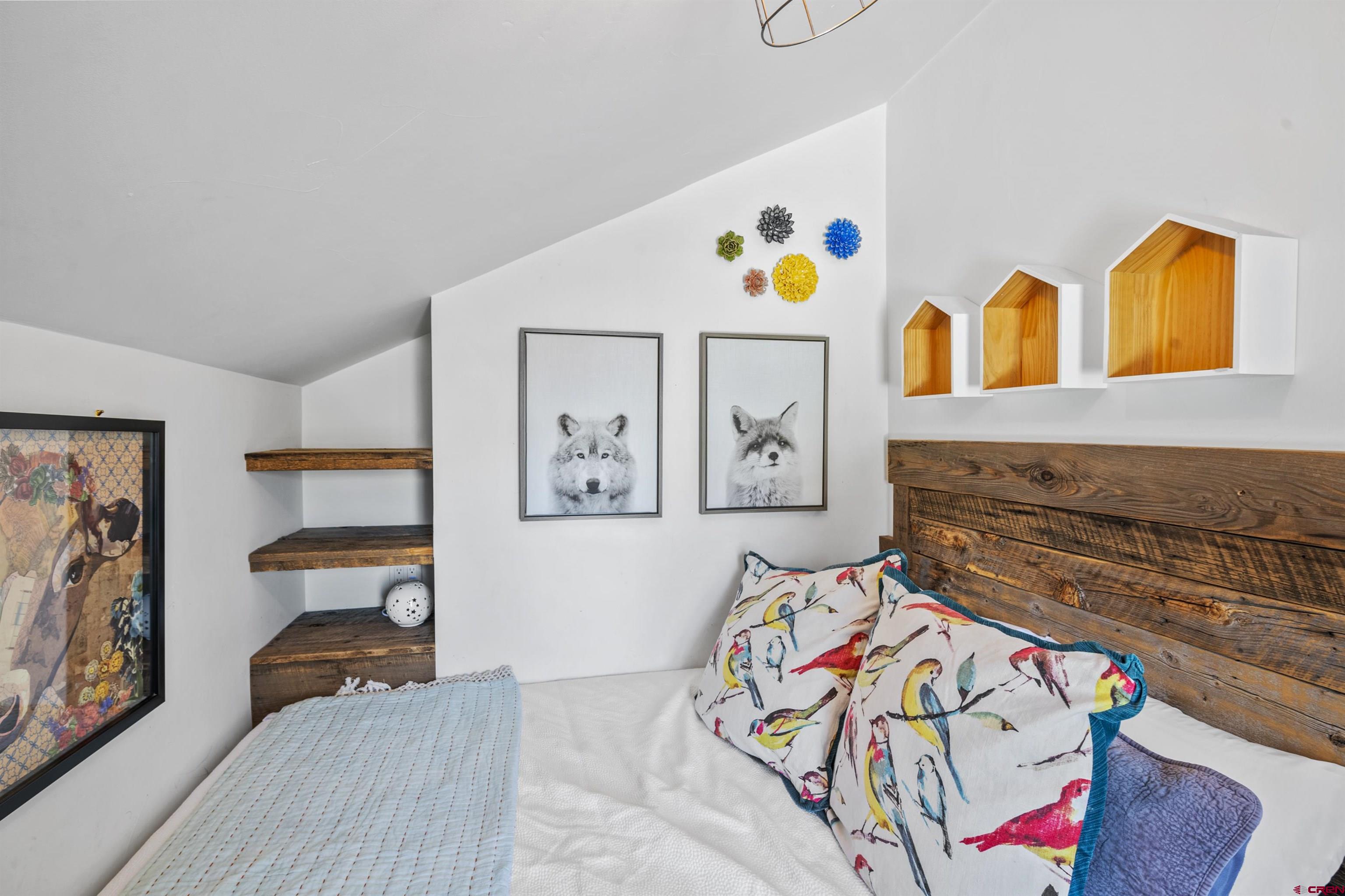 640 Elk Avenue Crested Butte, CO 81224 - Photo 42 of 45 a bedroom with a bed and furniture