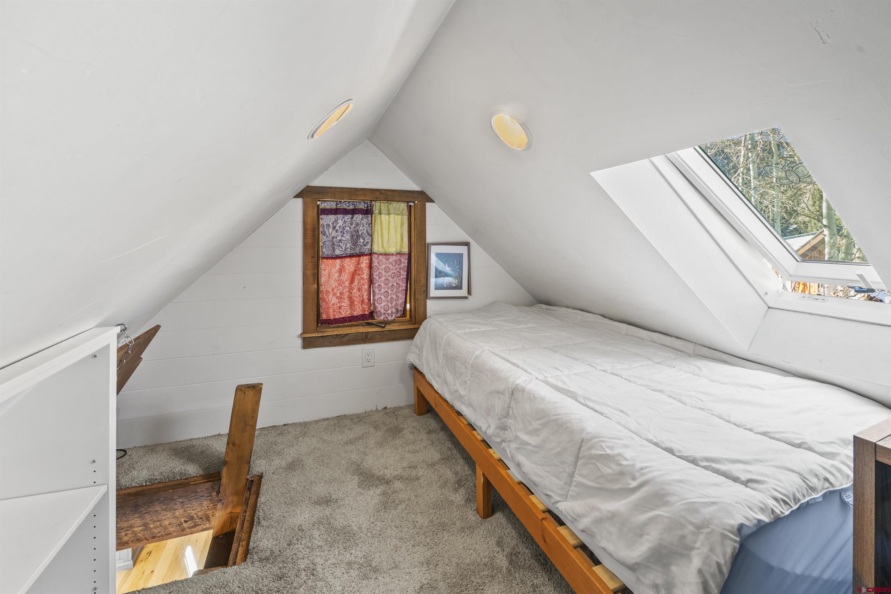 640 Elk Avenue Crested Butte, CO 81224 - Photo 44 of 45 a bedroom with a bed and a window