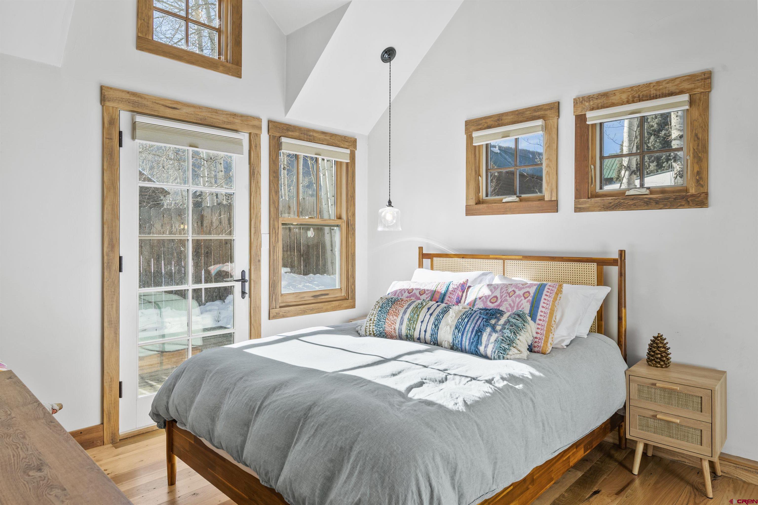 640 Elk Avenue Crested Butte, CO 81224 - Photo 7 of 45 a bedroom with a bed and a window