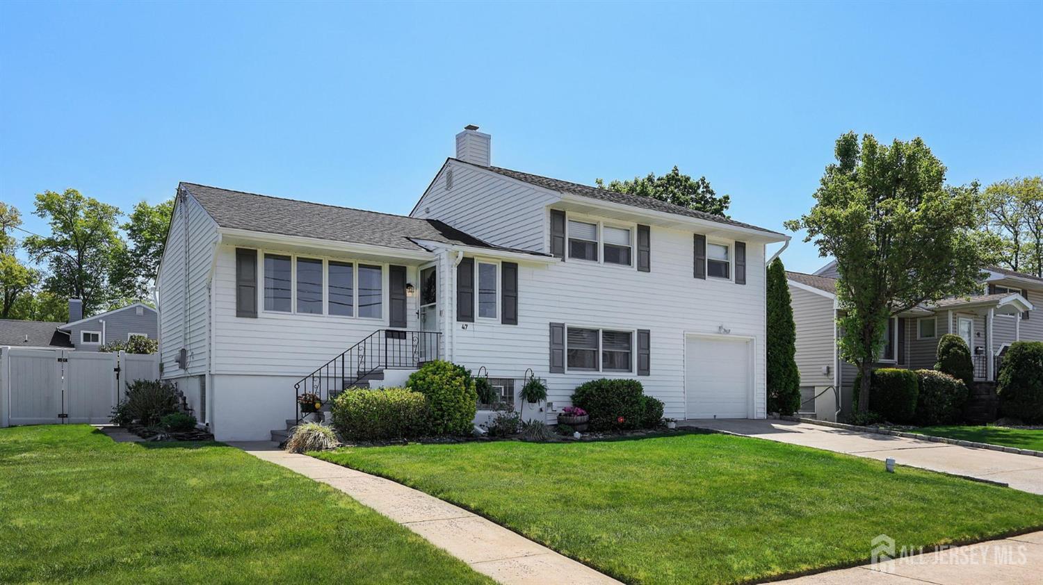 47 Miliken Road Colonia, NJ 07067 - Photo 2 of 40 a front view of a house with a yard