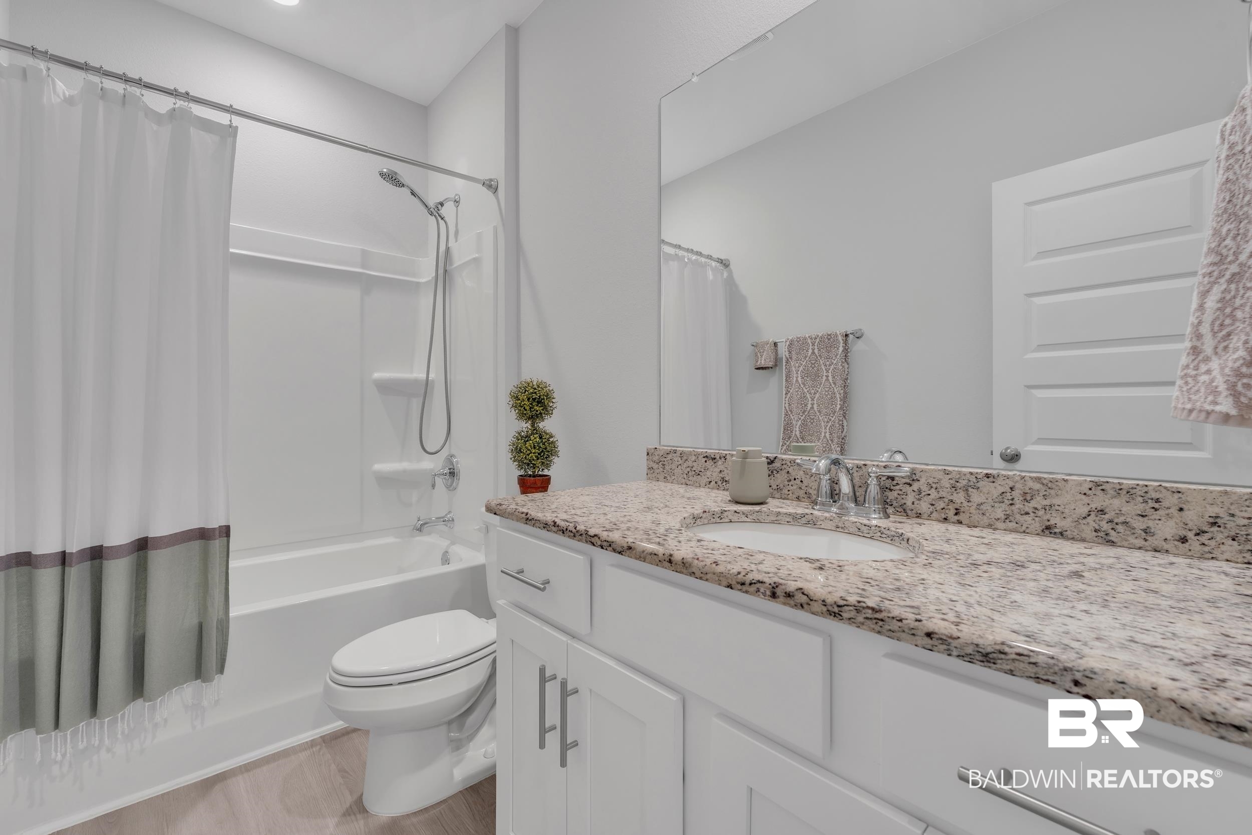 8774 Primland Boulevard Foley, AL 36535 - Photo 33 of 49 Full bathroom featuring shower / bath combination with curtain and vanity