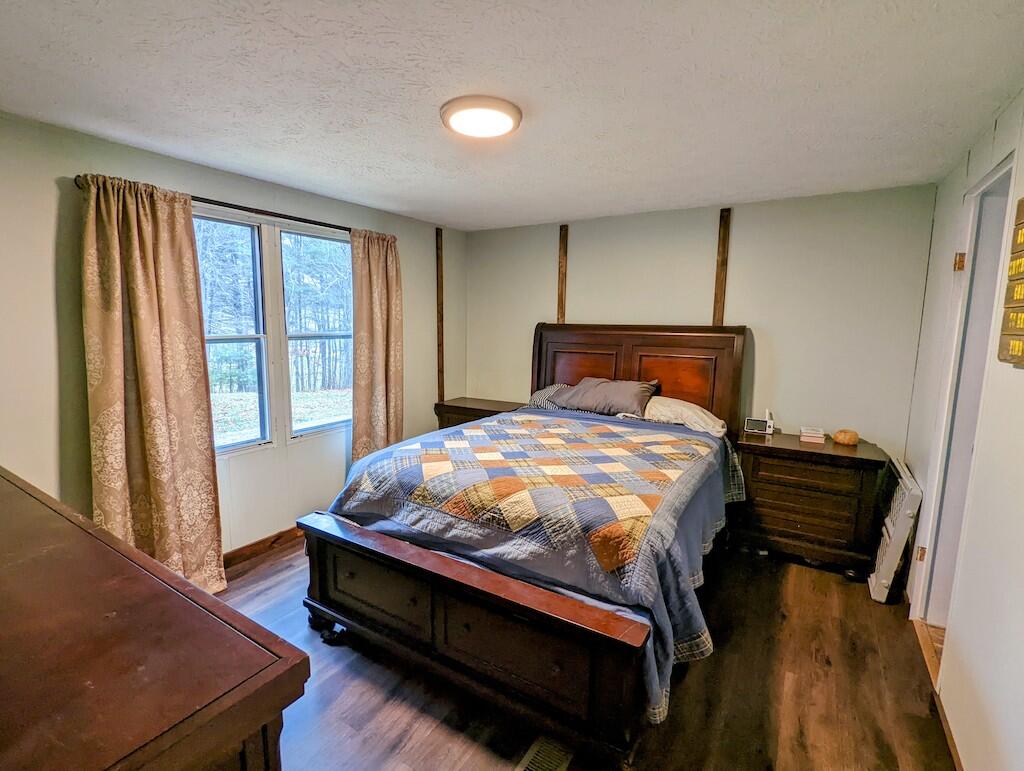 1555 Coles Knob Road Northeast Check, VA 24072 - Photo 11 of 27 a bed sitting in a bedroom next to a window