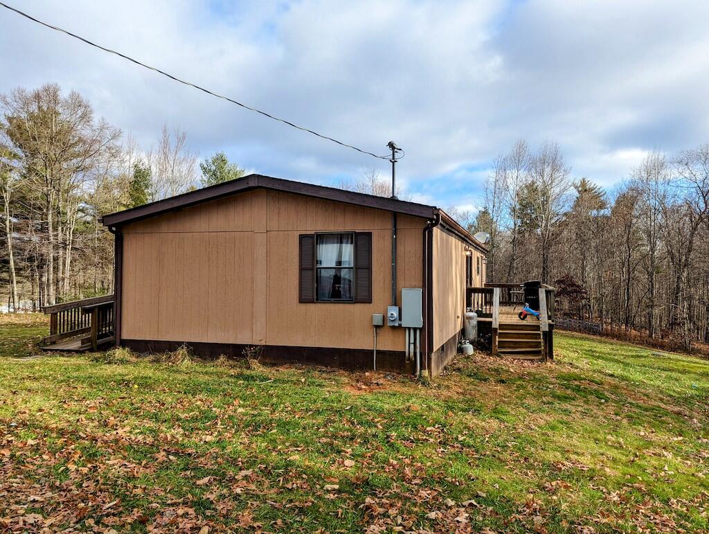 1555 Coles Knob Road Northeast Check, VA 24072 - Photo 19 of 27 a view of a house with a yard