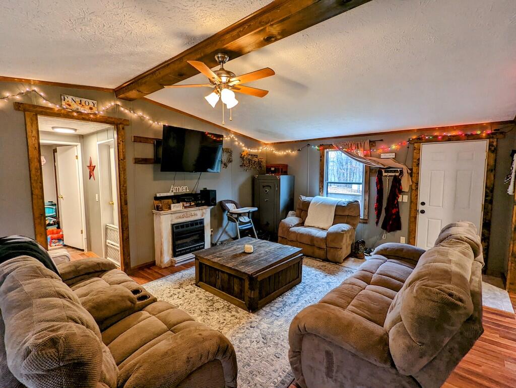 1555 Coles Knob Road Northeast Check, VA 24072 - Photo 2 of 27 a living room with furniture and a flat screen tv