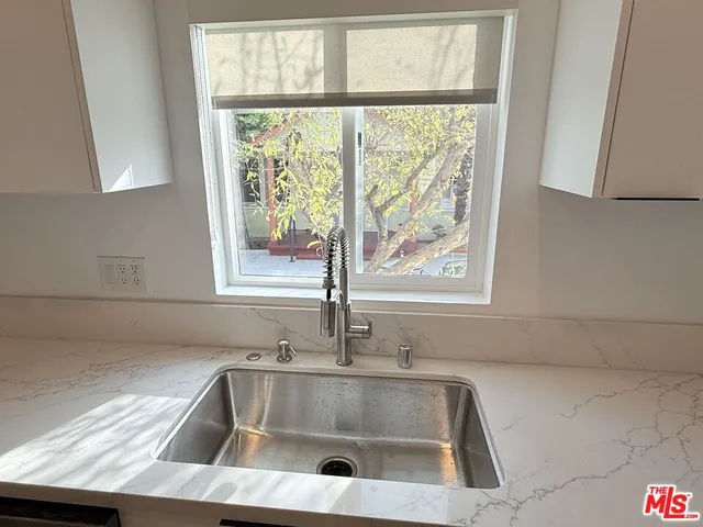 a kitchen with a sink and a window