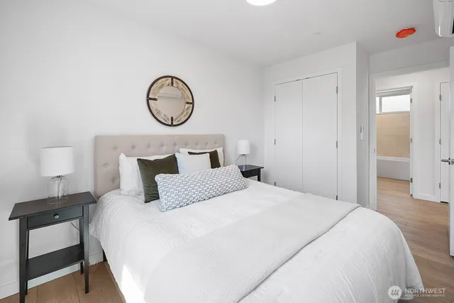 a bedroom with bed and a closet