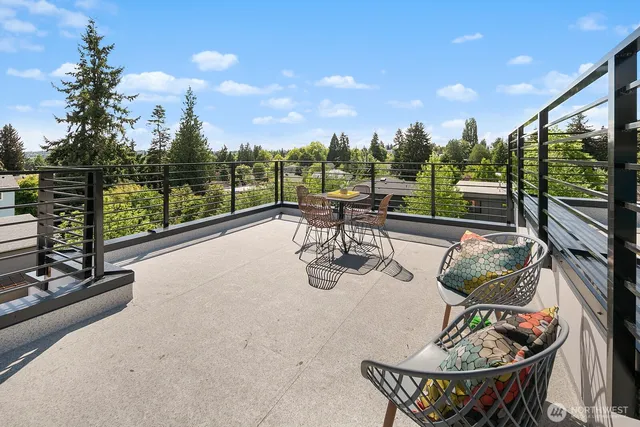 a view of a chairs and table in patio