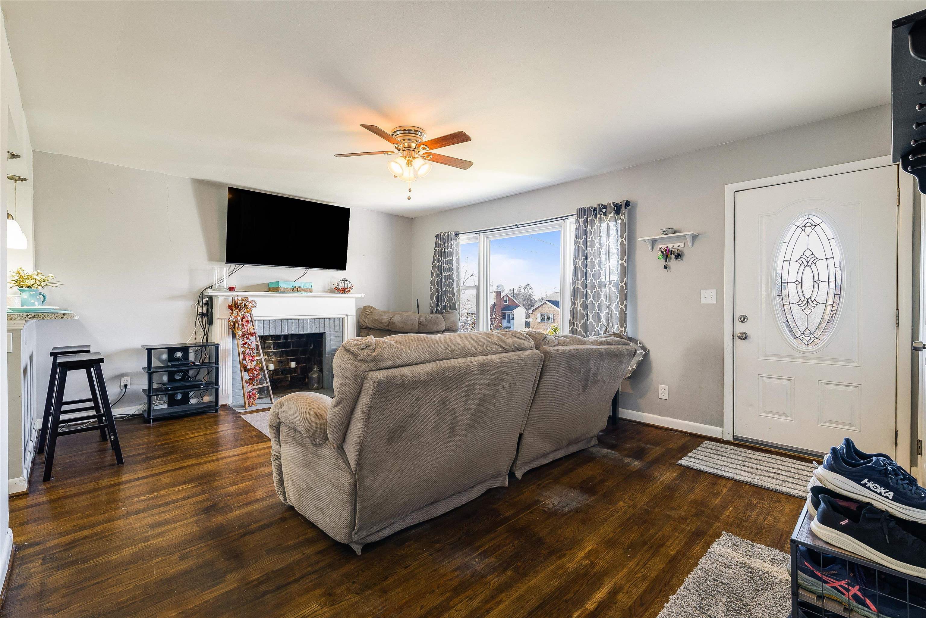 812 Florence Avenue Waynesboro, VA 22980 - Photo 6 of 24 a living room with furniture a fireplace and a flat screen tv