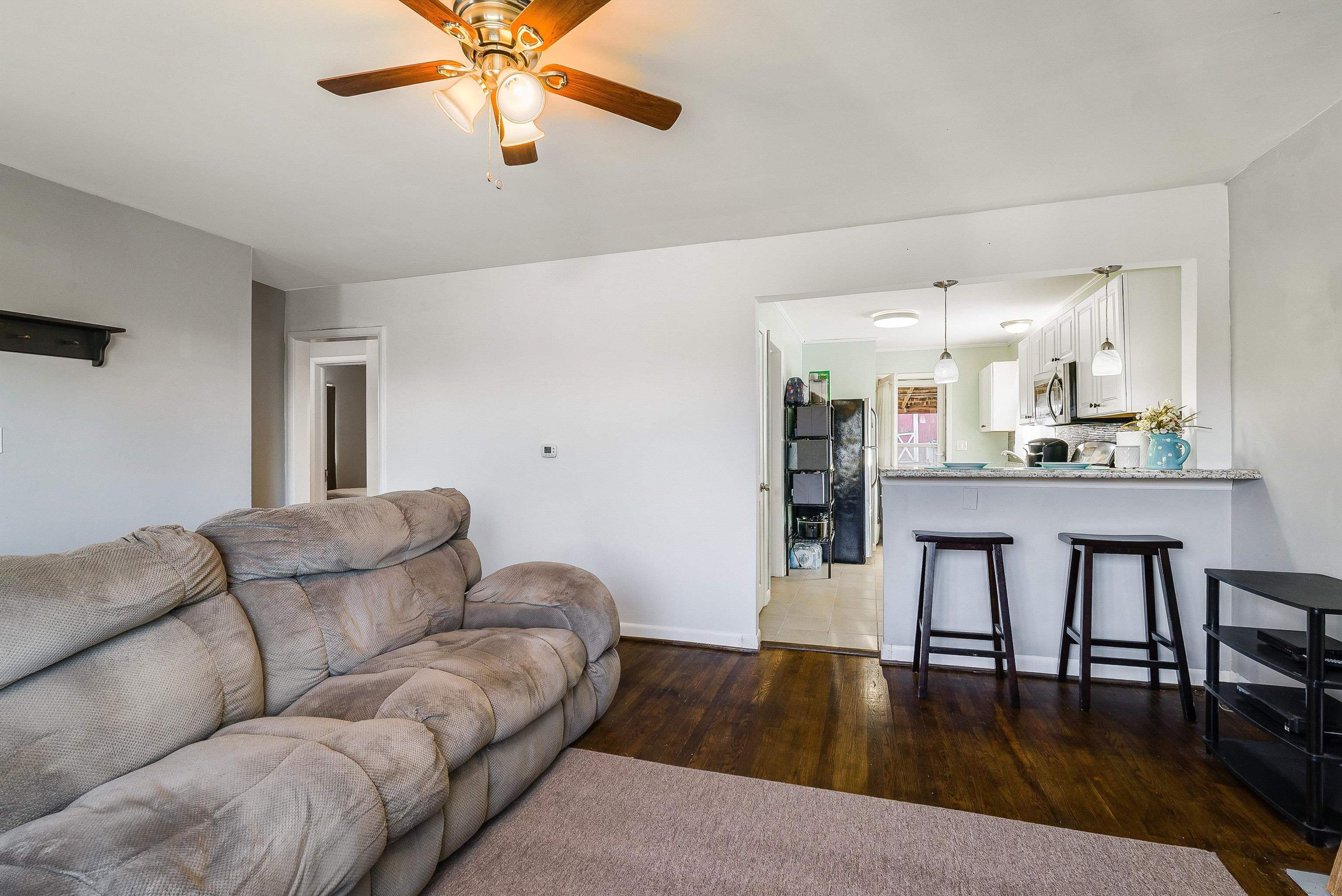 812 Florence Avenue Waynesboro, VA 22980 - Photo 7 of 24 a living room with furniture and a dining table with wooden floor