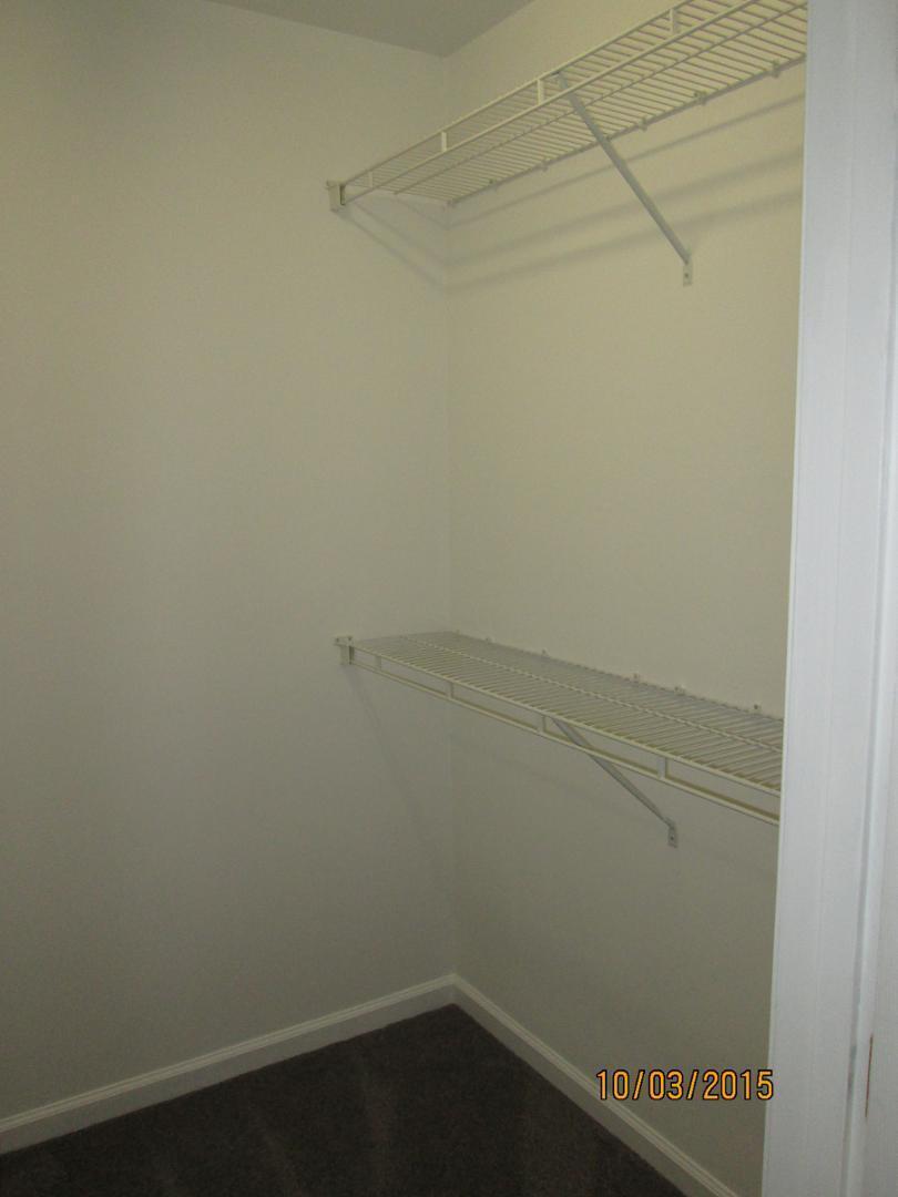 8521 Silhouette Place Raleigh, NC 27613 - Photo 12 of 20 a view of small space with racks on the wall