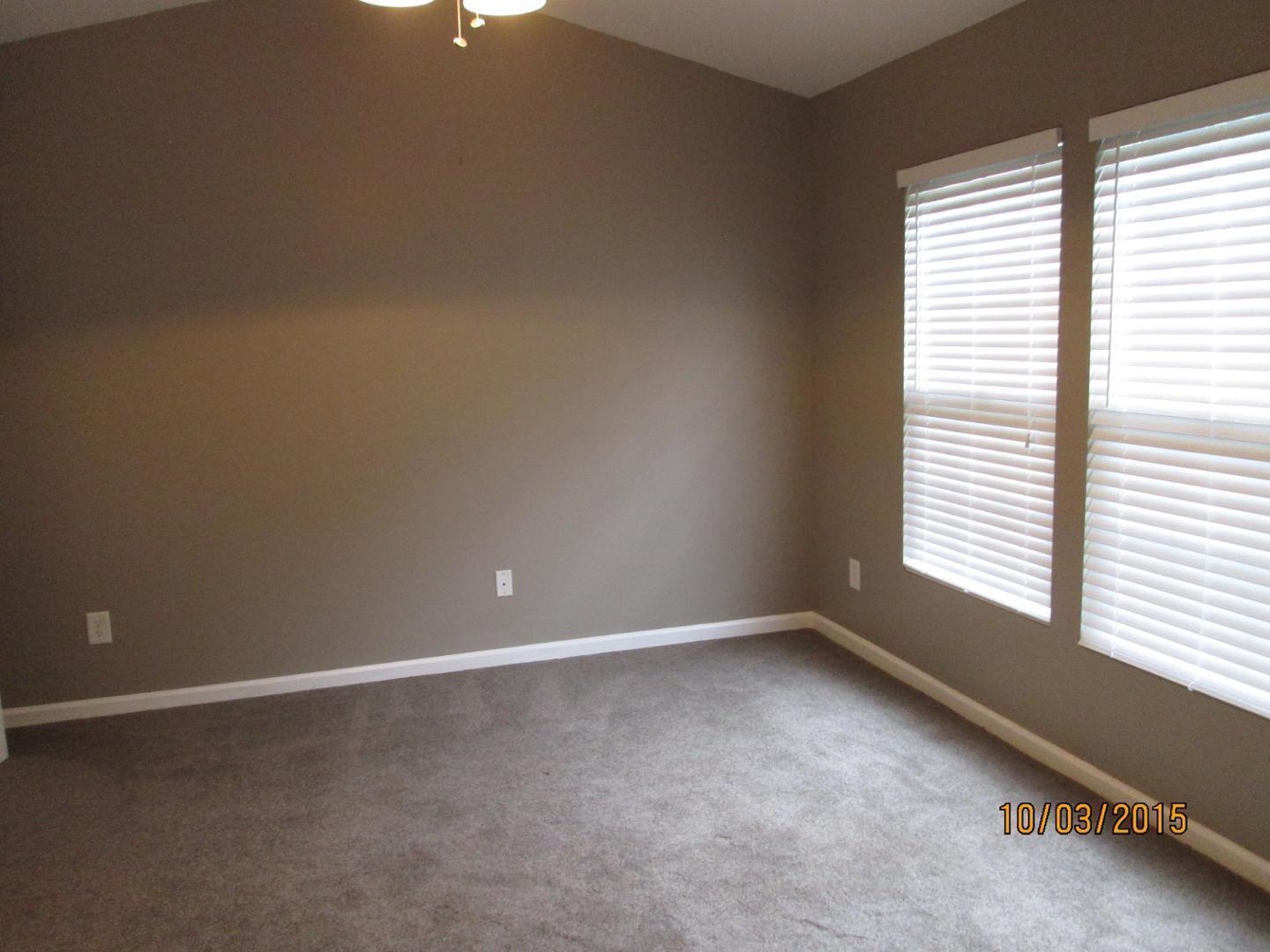 8521 Silhouette Place Raleigh, NC 27613 - Photo 10 of 20 an empty room with a window