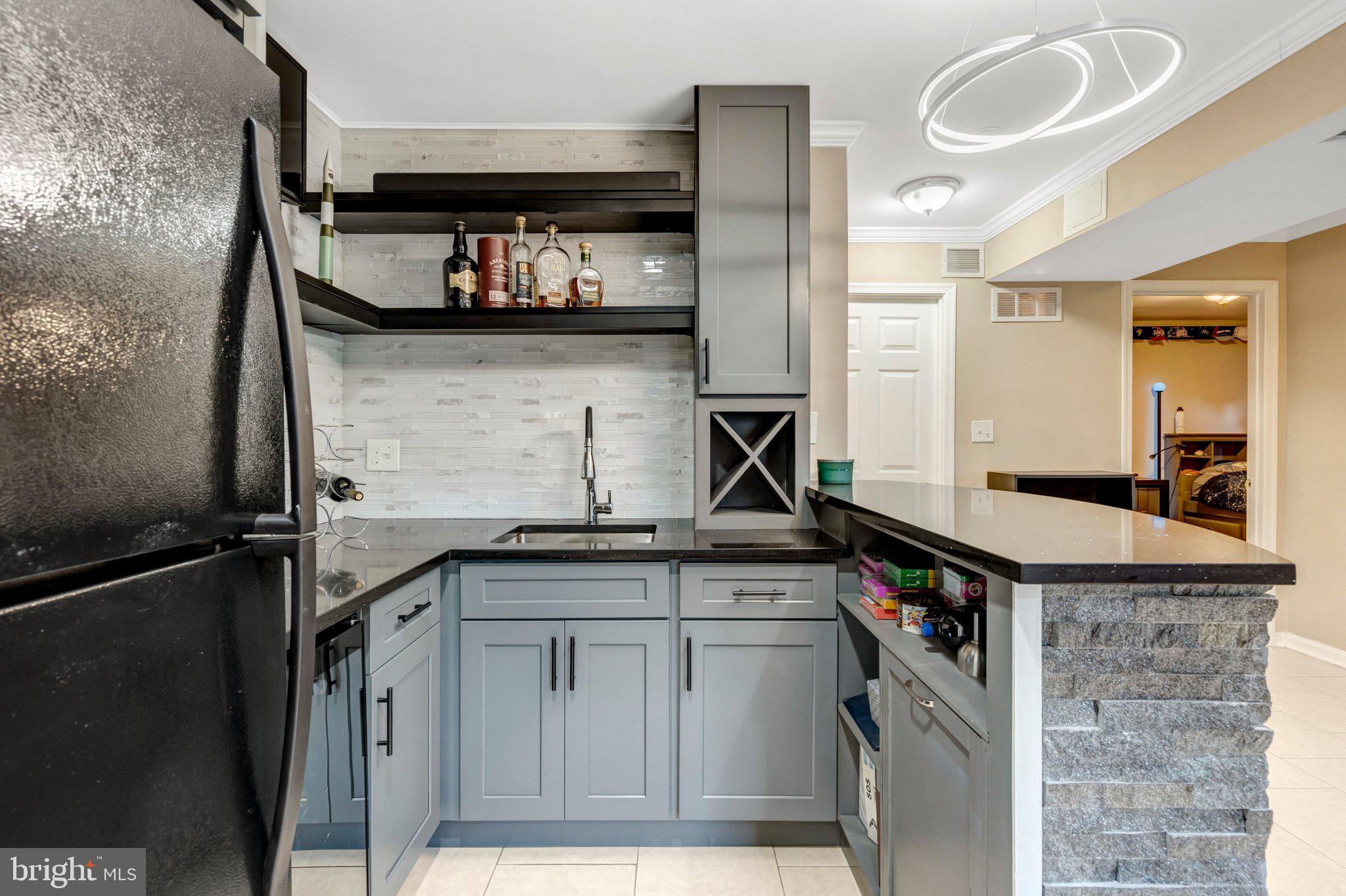 7212 Galgate Drive Springfield, VA 22153 - Photo 25 of 39 a kitchen with a sink and cabinets