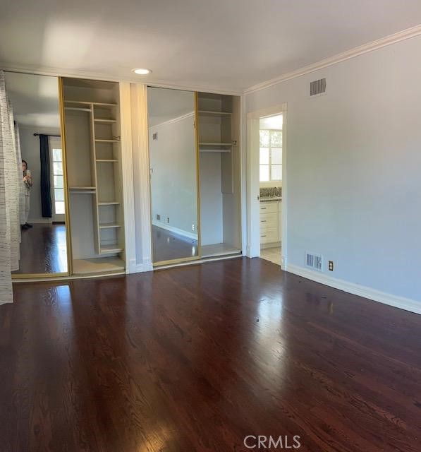 1637 Rodeo Road Arcadia, CA 91006 - Photo 11 of 29 an empty room with wooden floor and windows