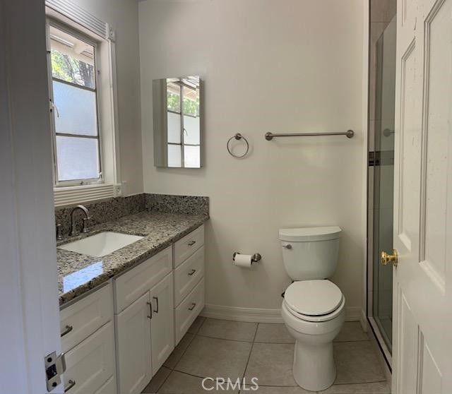 1637 Rodeo Road Arcadia, CA 91006 - Photo 12 of 29 a bathroom with a granite countertop toilet a sink and a window