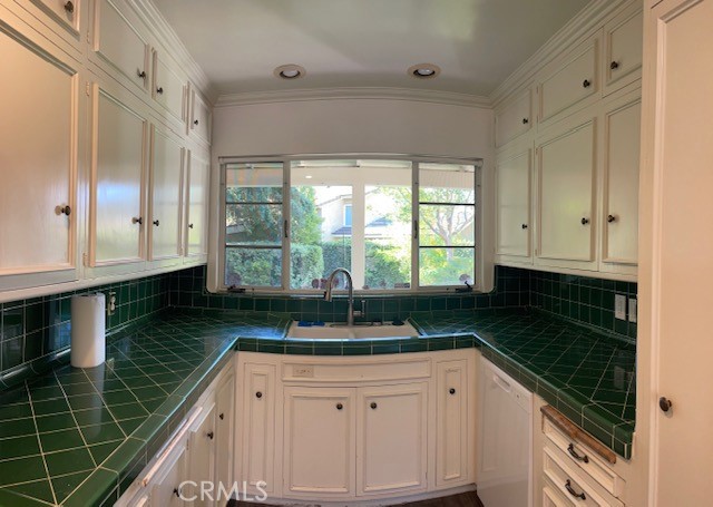 1637 Rodeo Road Arcadia, CA 91006 - Photo 6 of 29 a kitchen with granite countertop a sink window and cabinets