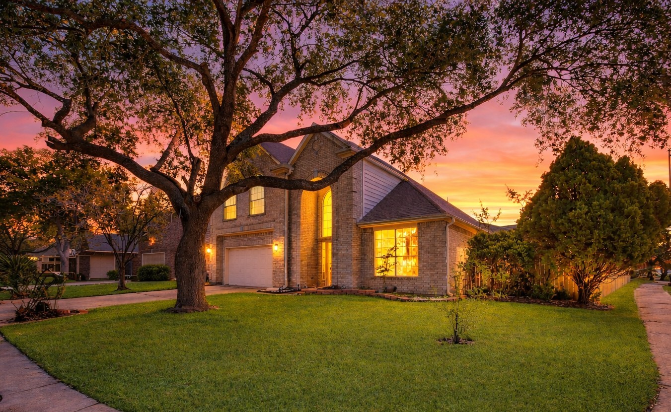 Beautifully maintained two-story brick home situated on a spacious, oversized lot with lush grass that enhances its curb appeal