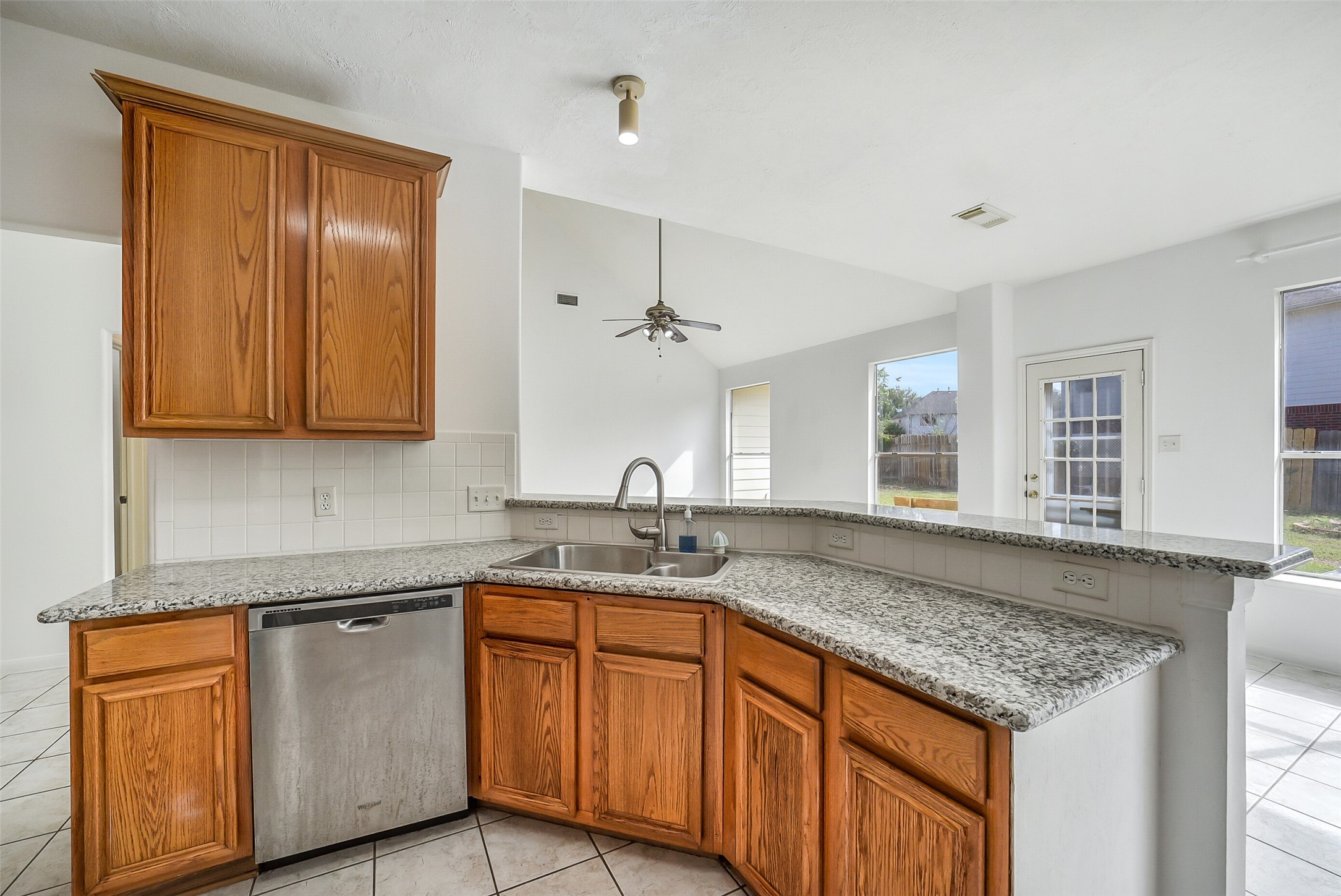 3502 Sweetspire Road Katy, TX 77449 - Photo 11 of 30 Kitchen featuring a convenient breakfast bar, perfect for casual dining, quick meals, or entertaining guests.