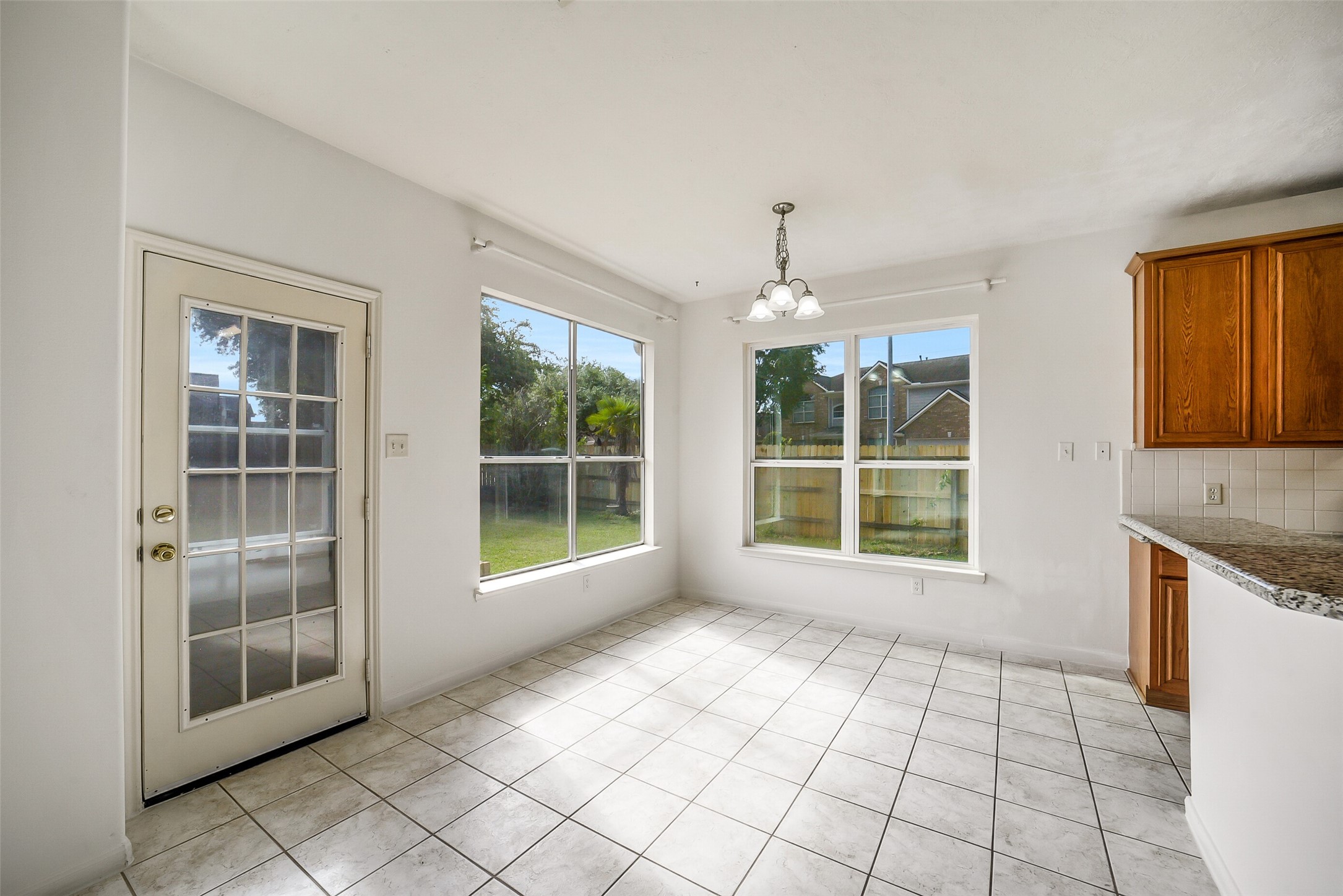 3502 Sweetspire Road Katy, TX 77449 - Photo 12 of 30 Bright and inviting breakfast room filled with abundant natural light and large windows overlooking the backyard. This comfortable space offers a peaceful setting for casual dining, with scenic views that create a warm and relaxing atmosphere throughout the day.