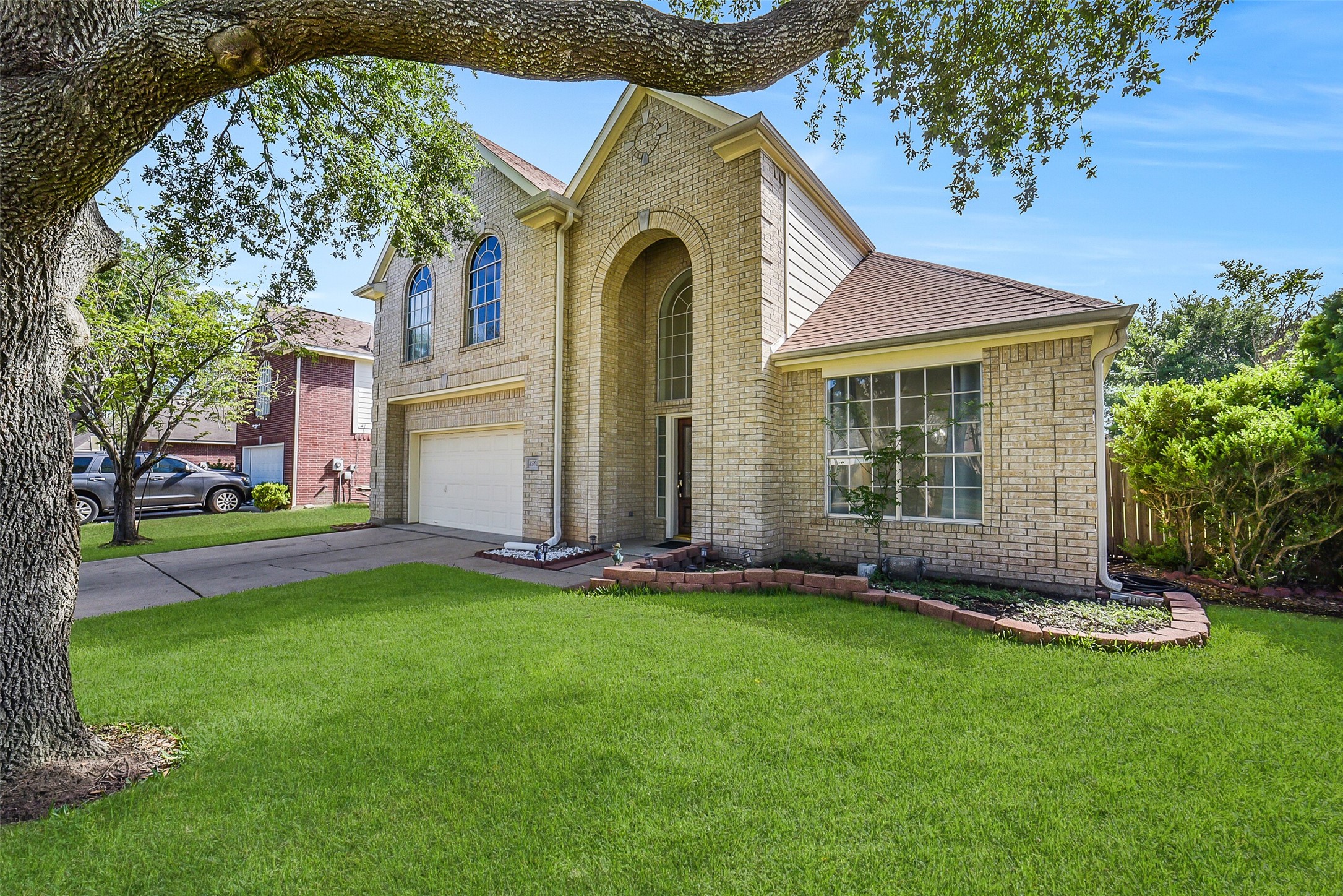 3502 Sweetspire Road Katy, TX 77449 - Photo 2 of 30 A well-maintained front yard featuring a mature, large tree that adds charm and shade.