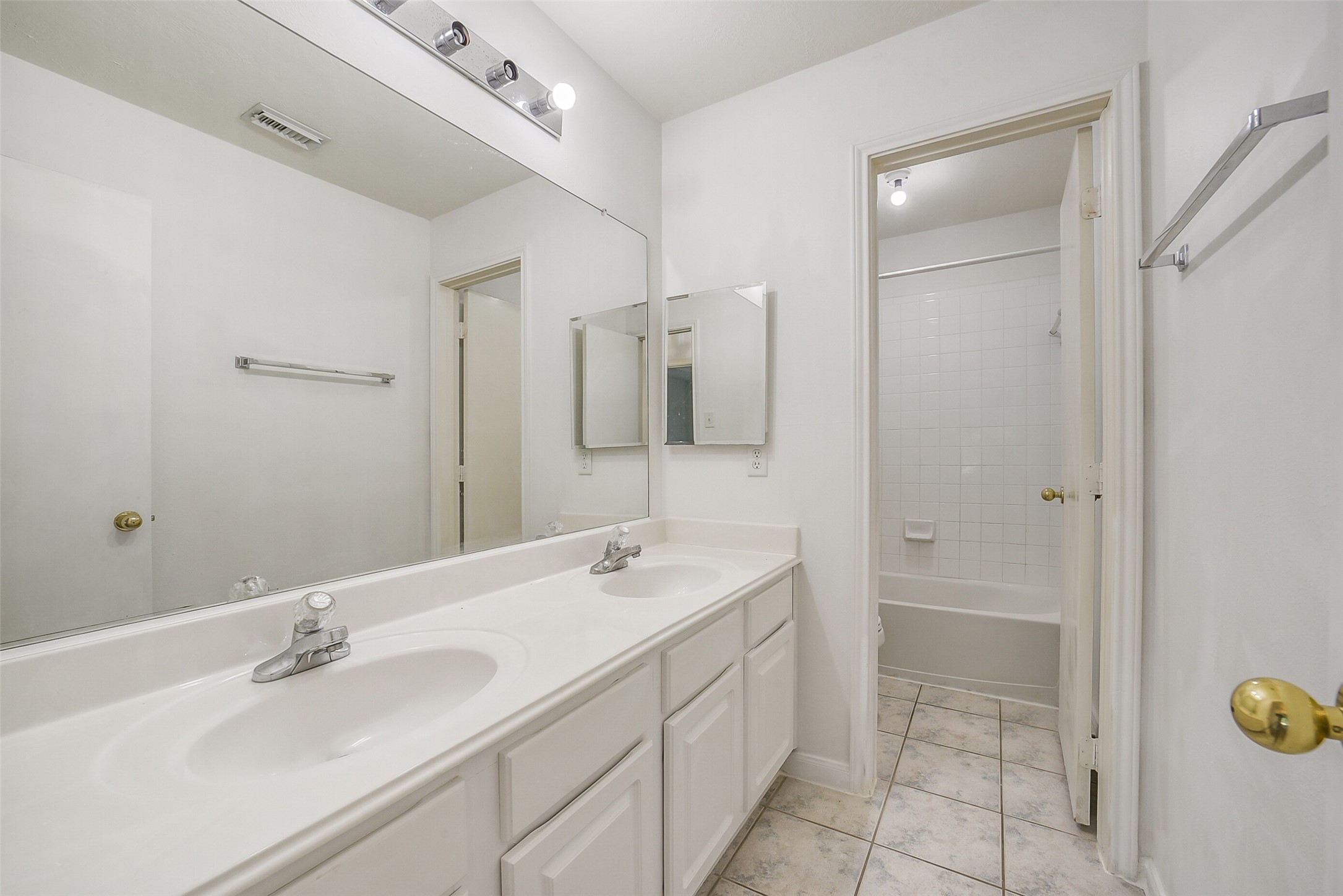 3502 Sweetspire Road Katy, TX 77449 - Photo 23 of 30 The second-floor bathroom features a spacious layout with double sinks set in an elegant vanity, offering plenty of room for shared use.