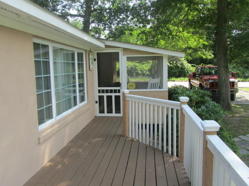 38 South Beechwood Road East Lyme, CT 06357 - Photo 1 of 1 a view of a wooden deck and a yard