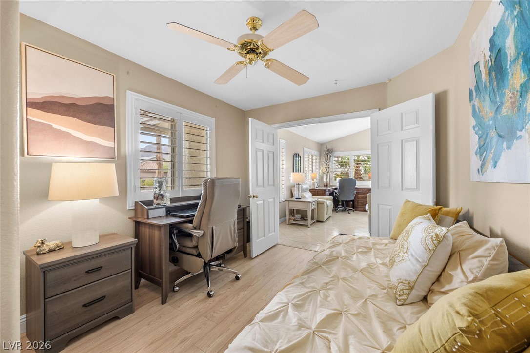 814 Manor Shores Road Henderson, NV 89002 - Photo 22 of 40 Gleaming wood flooring and classic shutters define this versatile home office and guest space.