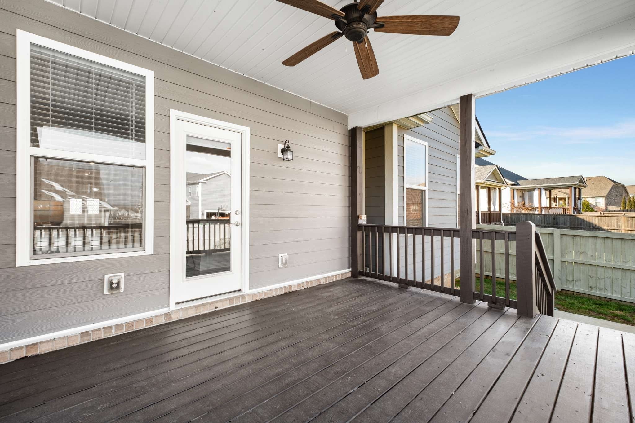 445 RANGELAND Road Spring Hill, TN 37174 - Photo 38 of 55 a view of a livingroom with wooden floor and a ceiling fan
