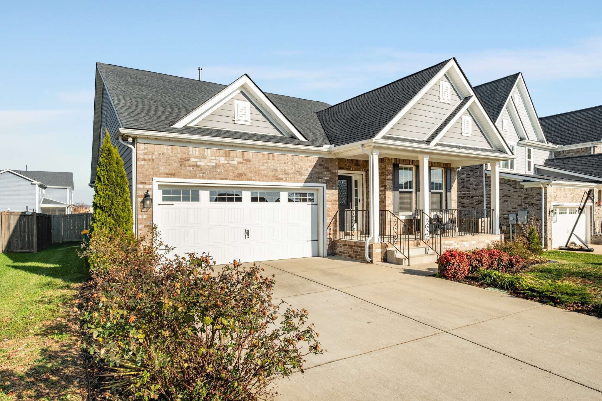 445 RANGELAND Road Spring Hill, TN 37174 - Photo 48 of 55 a front view of a house with a yard and garage