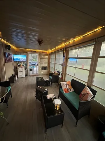 a view of a patio with table and chairs under an umbrella