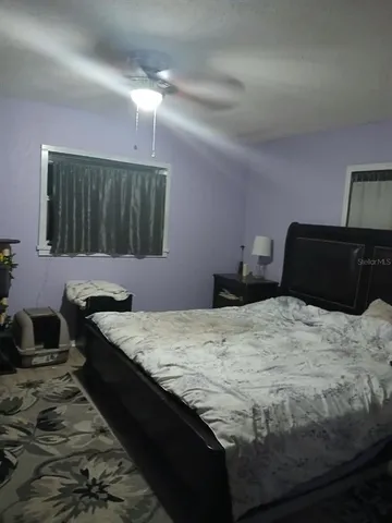 a dining room with furniture and a chandelier