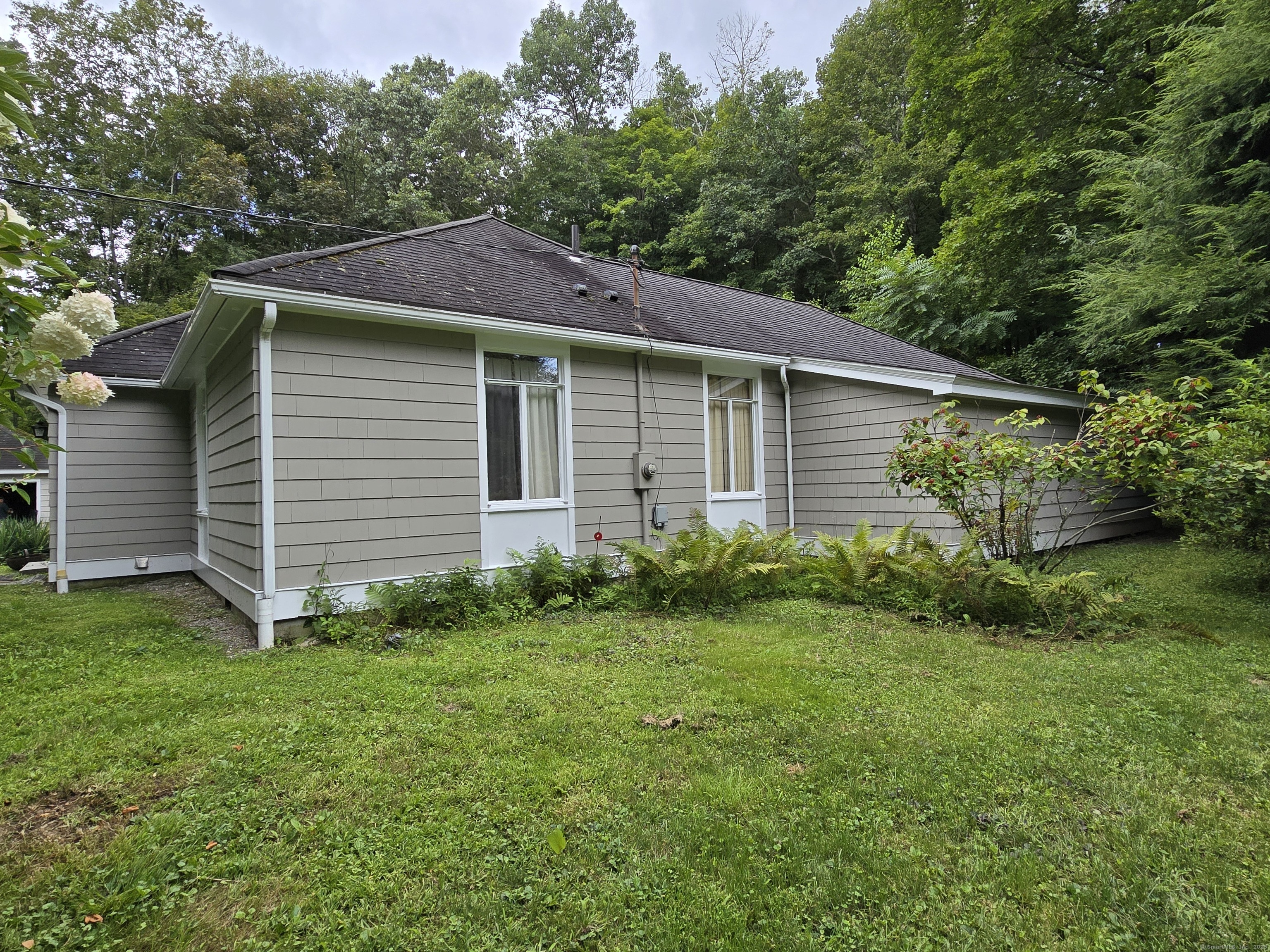 1 Sabbaday Lane Washington, CT 06793 - Photo 3 of 13 a front view of a house with garden