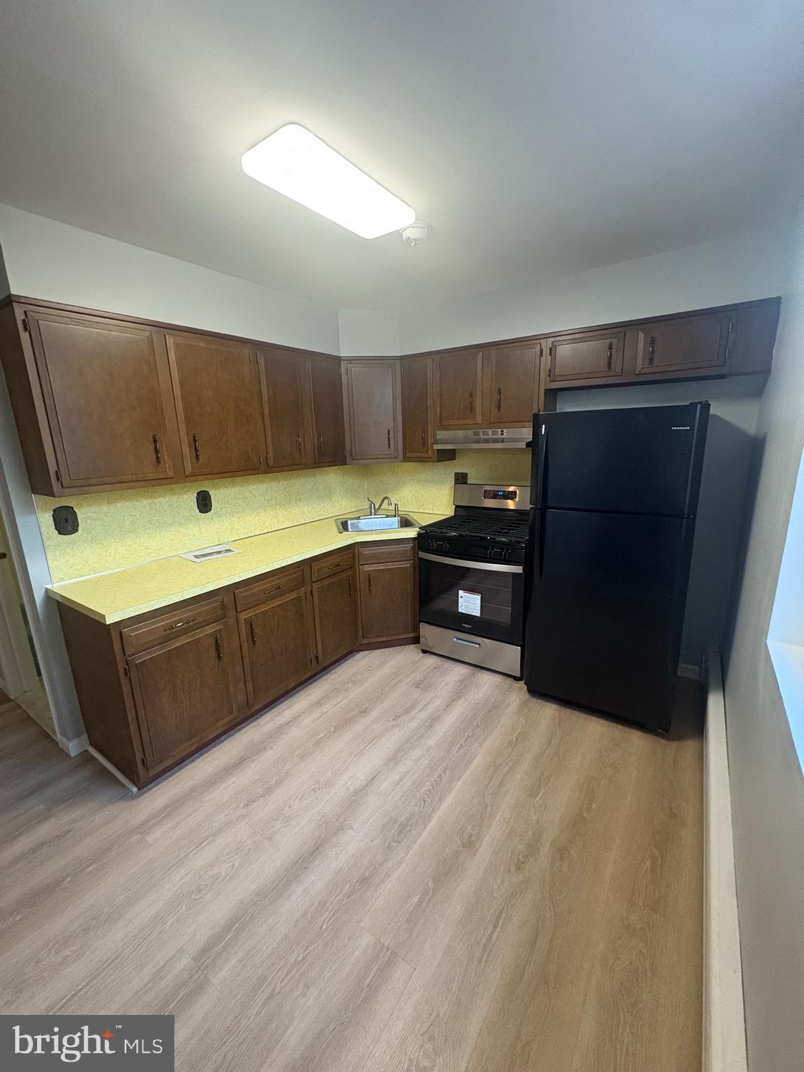 4564 Bermuda Street Philadelphia, PA 19124 - Photo 12 of 17 a large kitchen with a large counter top and sink