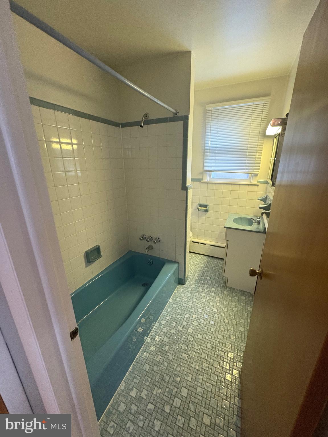 4564 Bermuda Street Philadelphia, PA 19124 - Photo 13 of 17 a bathroom with a sink a toilet and shower