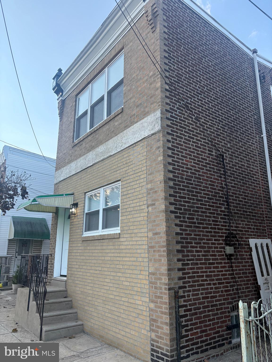 4564 Bermuda Street Philadelphia, PA 19124 - Photo 2 of 17 a view of a brick house with many windows