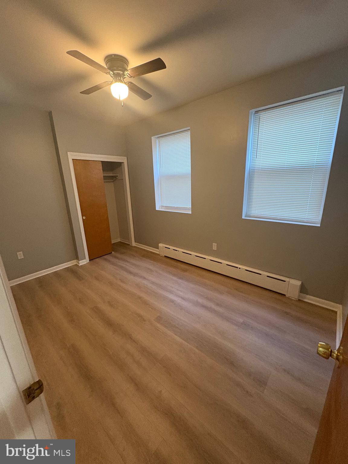 4564 Bermuda Street Philadelphia, PA 19124 - Photo 6 of 17 a view of a room with wooden floor and a ceiling fan