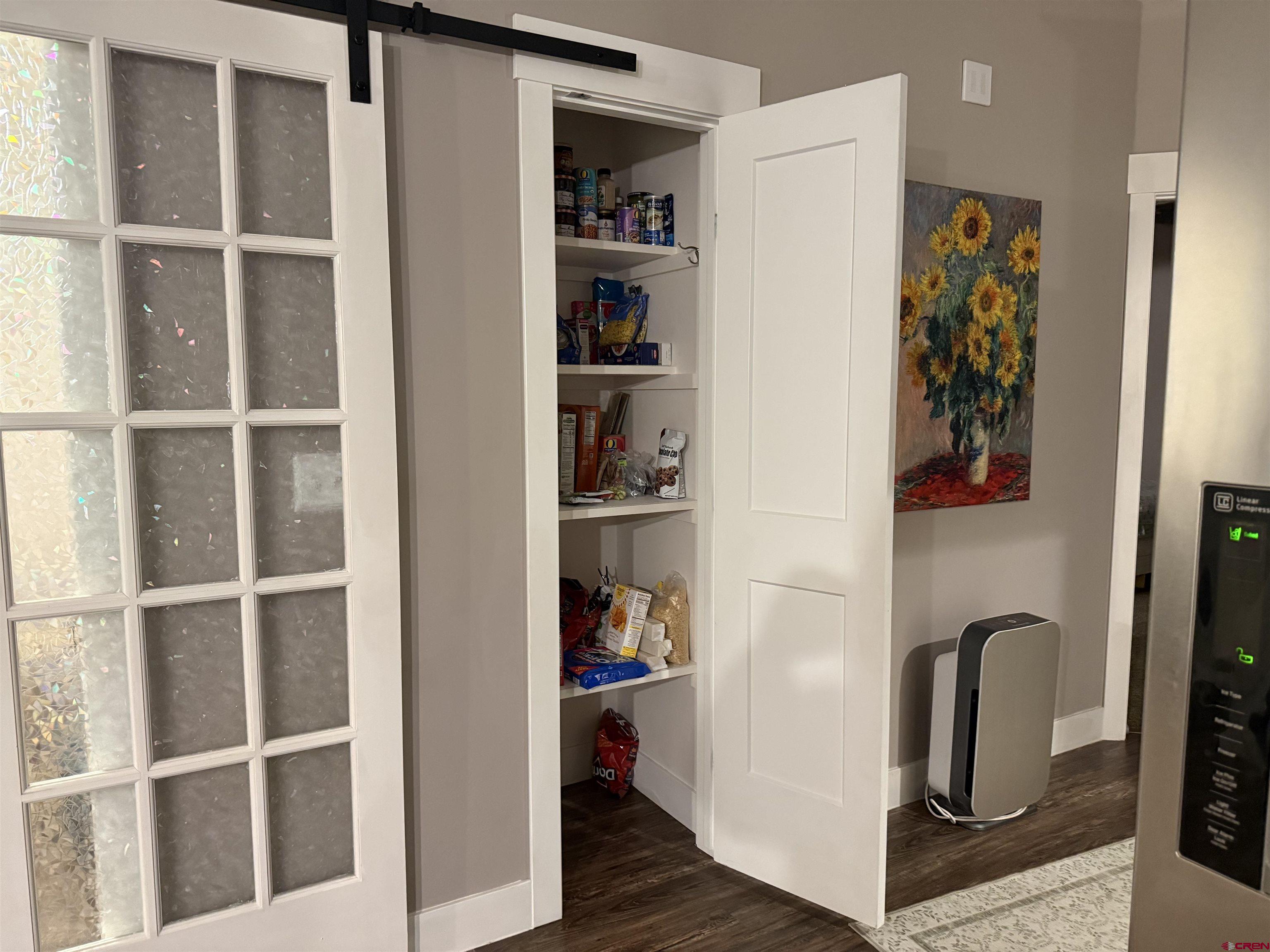 210 West 3rd Street, Unit 4 Cortez, CO 81321 - Photo 13 of 35 a picture of a bedroom with wooden floor and closet
