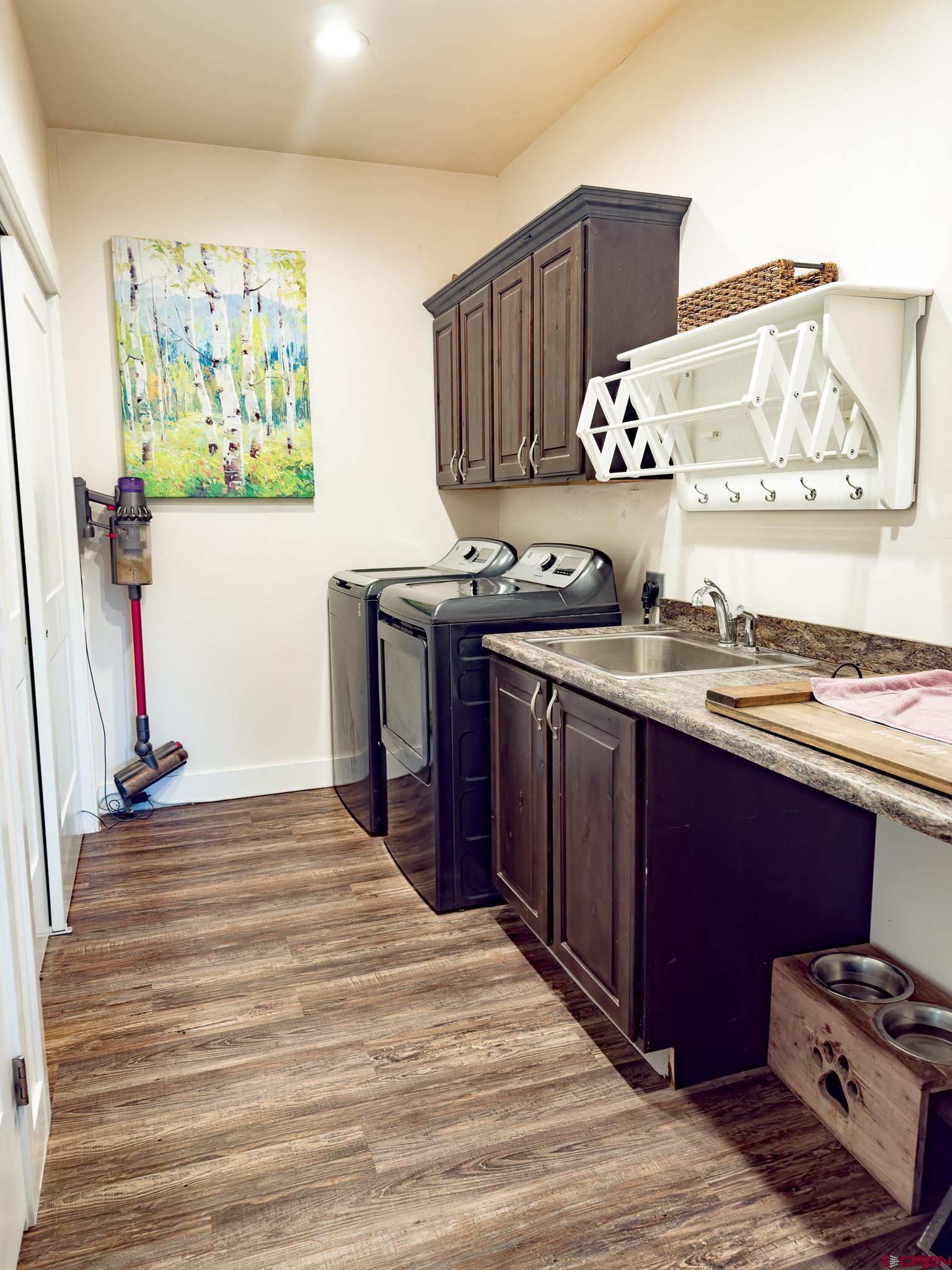 210 West 3rd Street, Unit 4 Cortez, CO 81321 - Photo 15 of 35 a kitchen with stainless steel appliances granite countertop a stove and a refrigerator