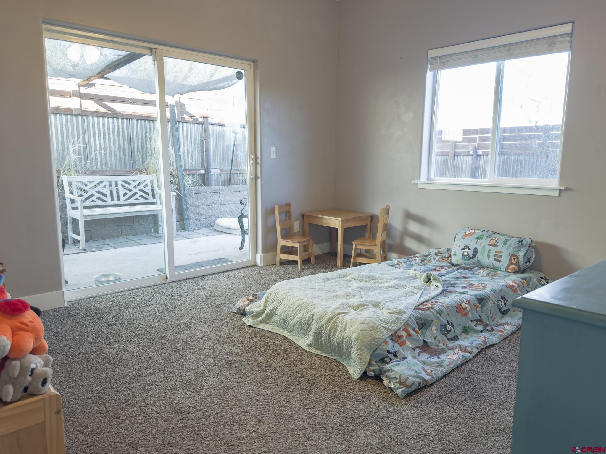 210 West 3rd Street, Unit 4 Cortez, CO 81321 - Photo 18 of 35 a bedroom with a bed and a window