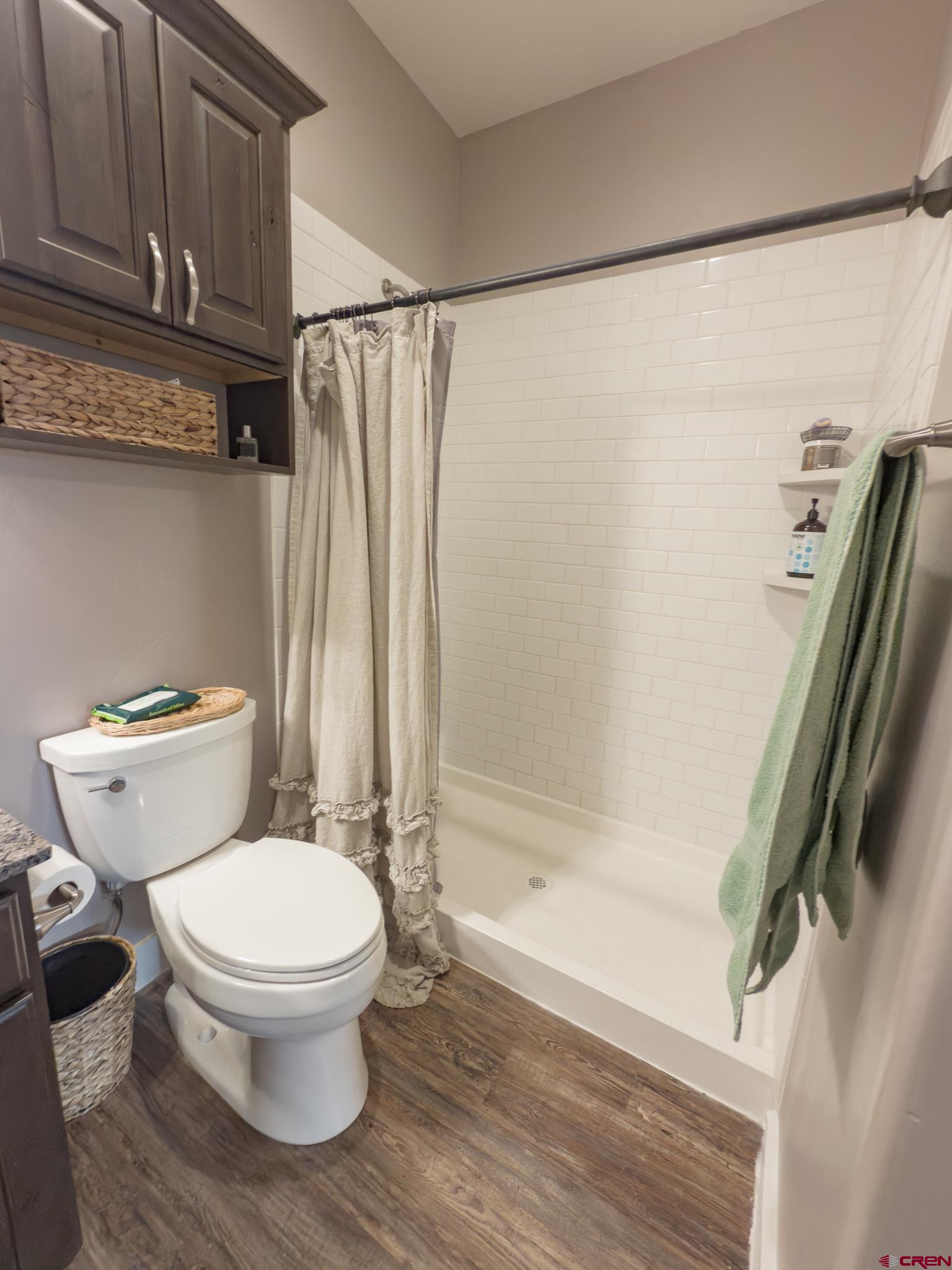 210 West 3rd Street, Unit 4 Cortez, CO 81321 - Photo 19 of 35 a bathroom with a toilet and a shower