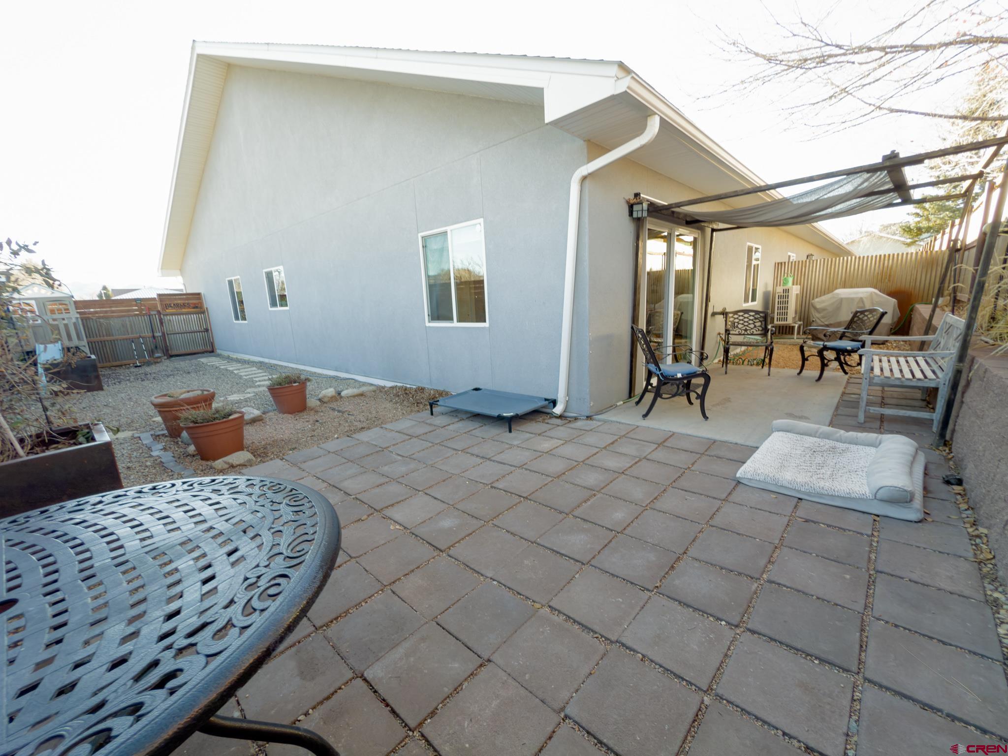 210 West 3rd Street, Unit 4 Cortez, CO 81321 - Photo 28 of 35 a bedroom with furniture and a chandelier